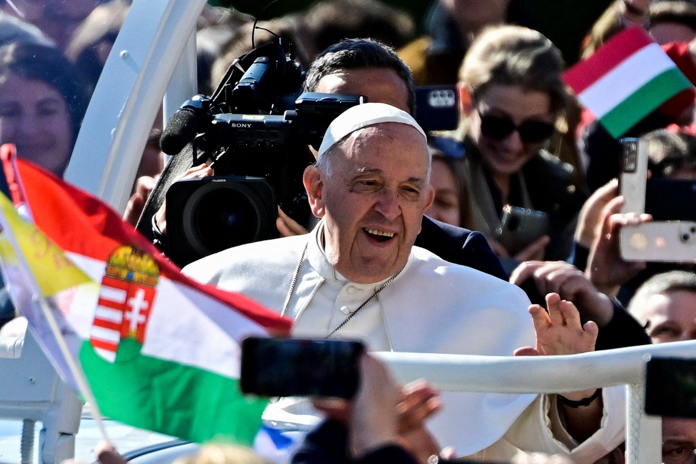 Pope Francis greets the crowd ahead of a holy mass at the Kossuth Lajos Square during his apostolic journey in Budapest, Hungary, April 30, 2023. REUTERS/Marton Monus  