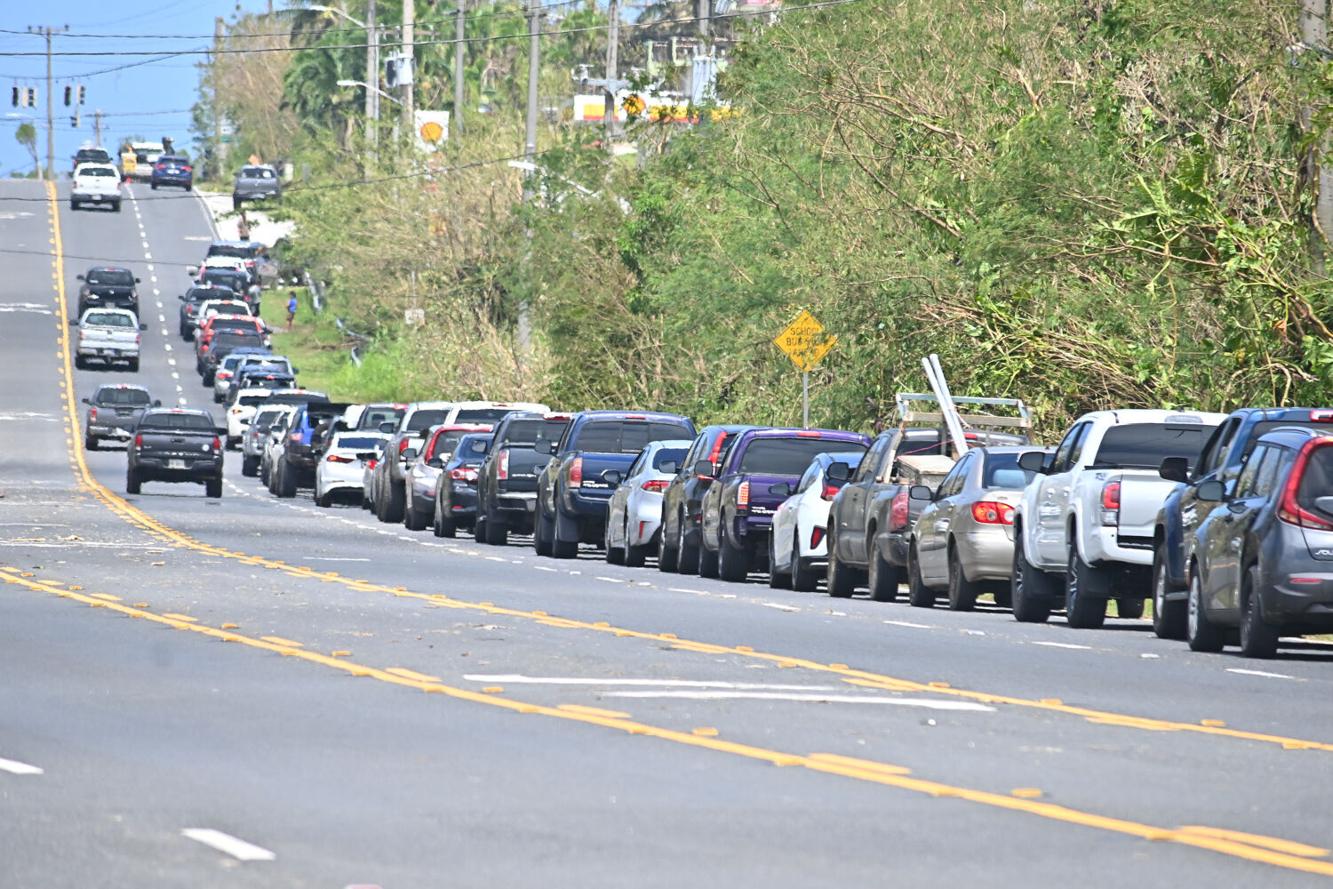 Long lines and gas shortages are occurring at the limited number of gas stations that have opened in the aftermath of Typhoon Mawar. Cars waiting for the opportunity to fuel are seen at the Shell station in Chalan Pago, Friday. 