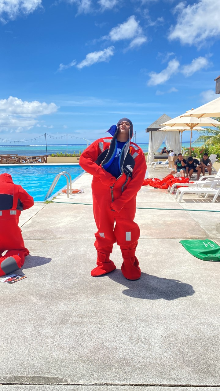 Michael Tomokane dons an immersion suit.