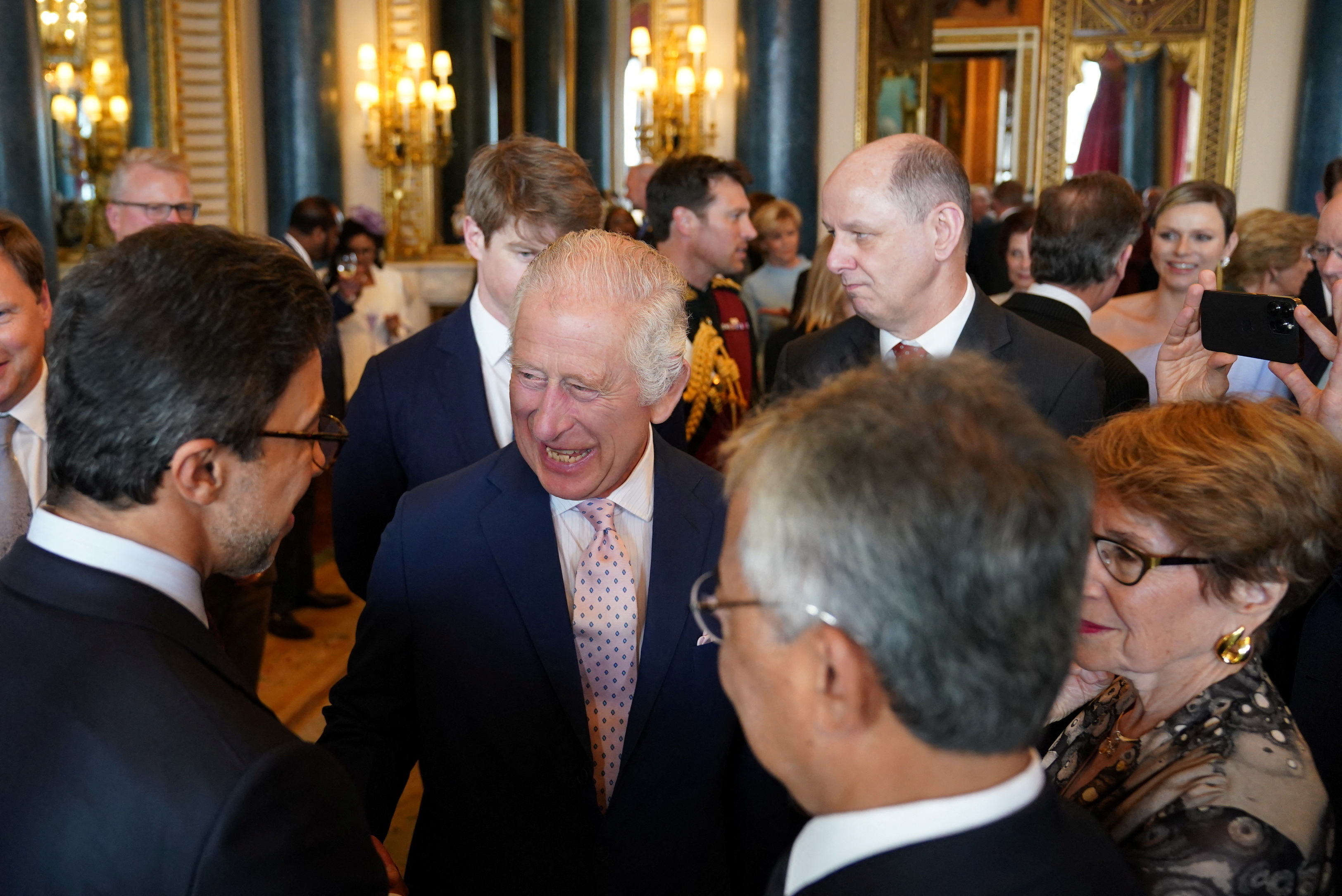Britain's King Charles speaks to guests during a reception for overseas guests attending his coronation at Buckingham Palace in London, Britain, May 5, 2023. Jacob King/Pool via REUTERS