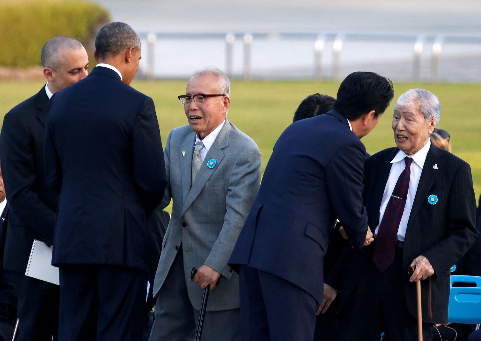 FILE PHOTO: U.S. President Barack Obama (2nd L) and Japanese Prime Minister Shinzo Abe (2nd R) talk with atomic bomb survivors Shigeaki Mori (3rd L) and Sunao Tsuboi during their visit at Hiroshima Peace Memorial Park in Hiroshima, Japan May 27, 2016. REUTERS/Toru Hanai