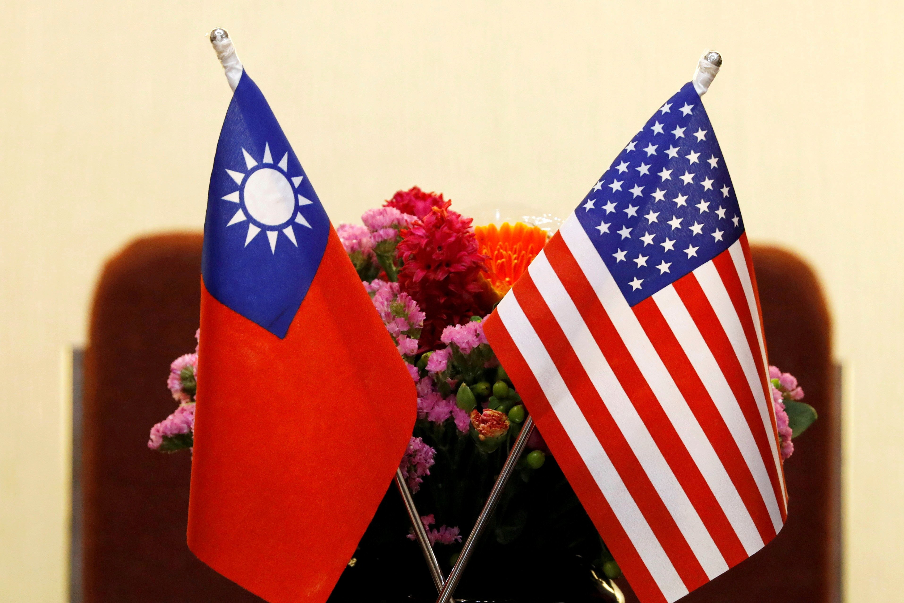 FILE PHOTO: Flags of Taiwan and U.S. are placed for a meeting in Taipei, Taiwan March 27, 2018. REUTERS/Tyrone Siu