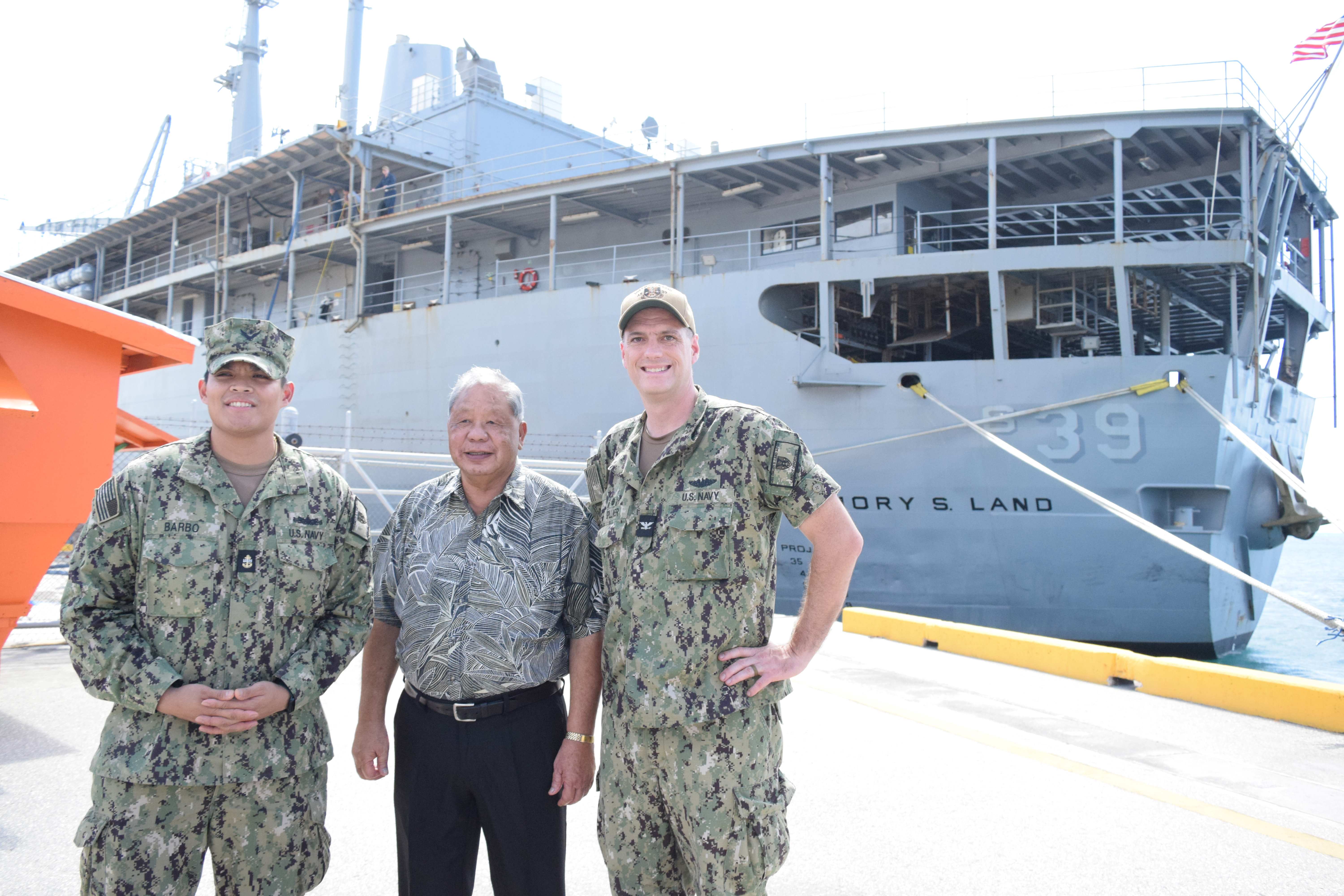 USS Emory S. Land Commanding Officer Capt. Brent Spillner, right, and Chief Petty Officer Kevin Barbo, left, with acting Gov. David M. Apatang at the port of Saipan on Tuesday.