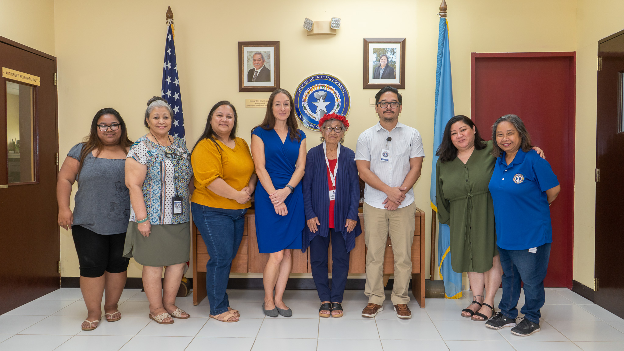 Honorary Governor Ana Nakatsukasa, 4th right, poses for a photo with staff from the Office of the Attorney General.