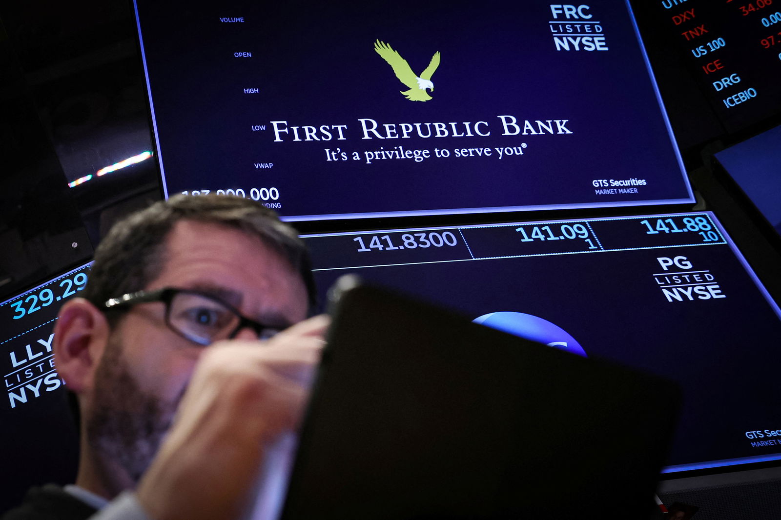 A trader works at the post where First Republic Bank stock is traded on the floor of the New York Stock Exchange in New York City, March 16, 2023.