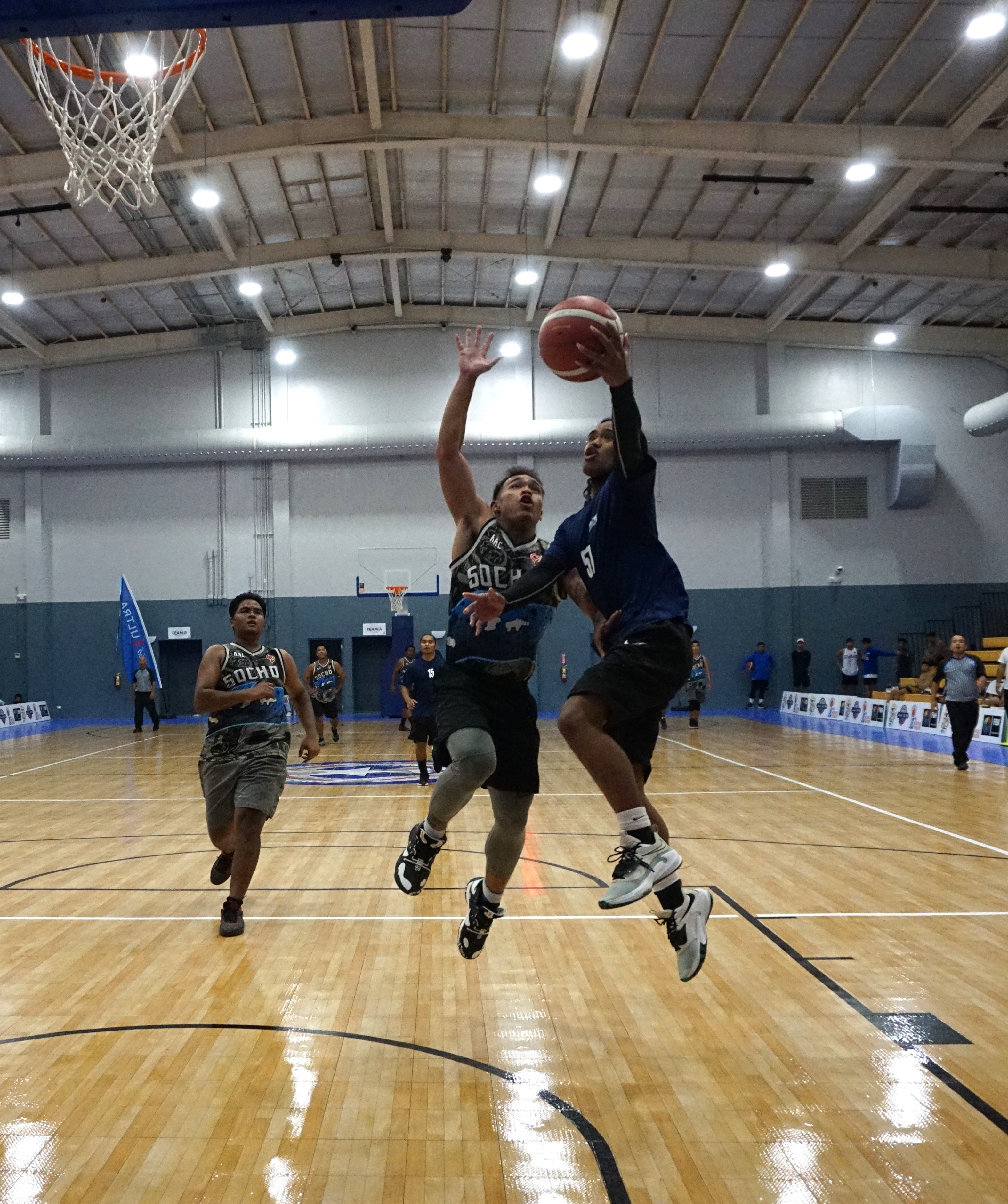 Martech Ol'Aces' Airson Atan gets fouled as he goes up for the finish against Socho during a playoff game of the Michelob Ultra Cup 2023 Tuesday at the Ada gym.