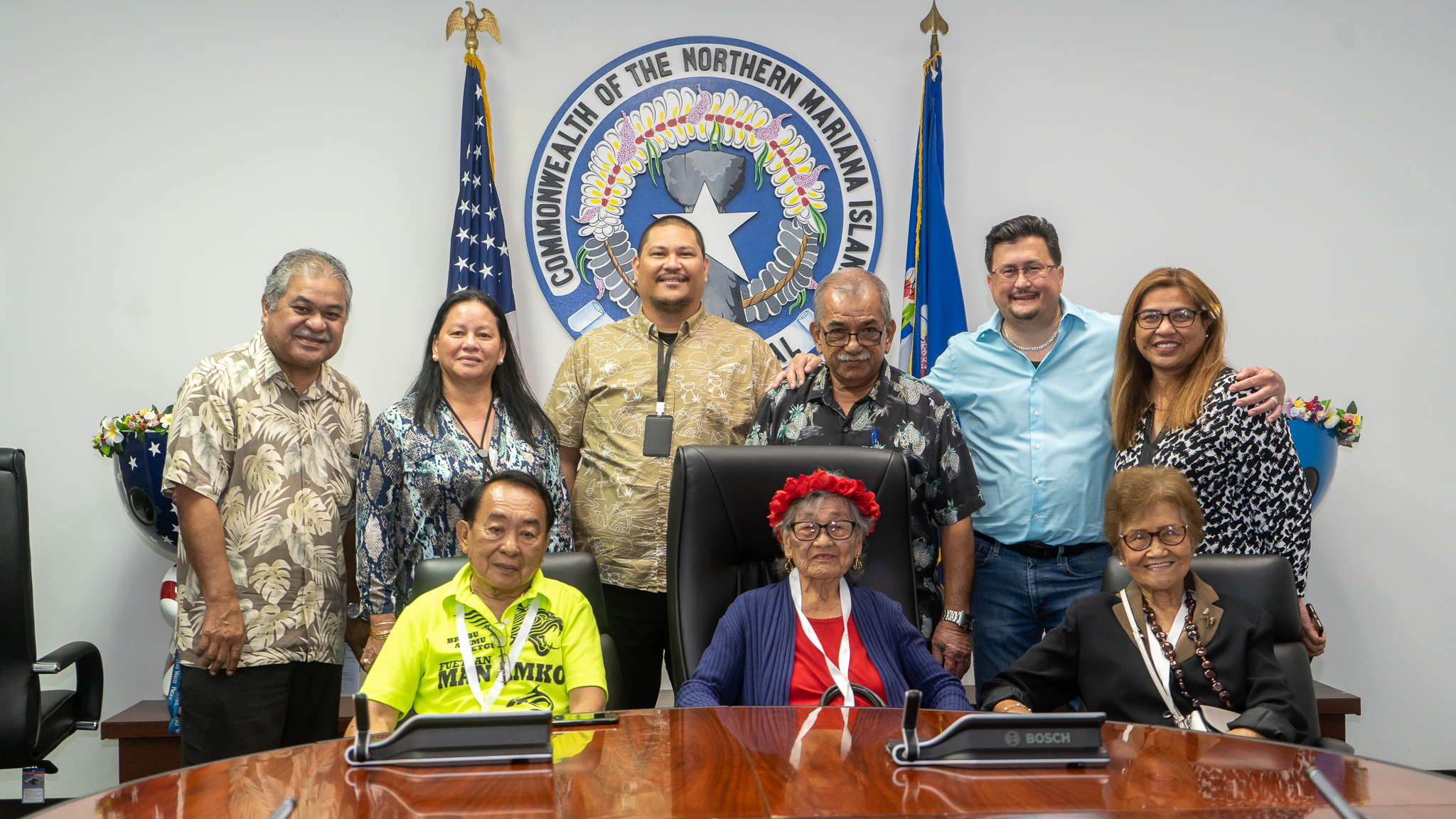 Honorary Governor Ana Nakatsukasa, center seated, meets with fellow Manamko' Takeover Day participants from the Legislature. Also in photo are lawmakers and administration officials.