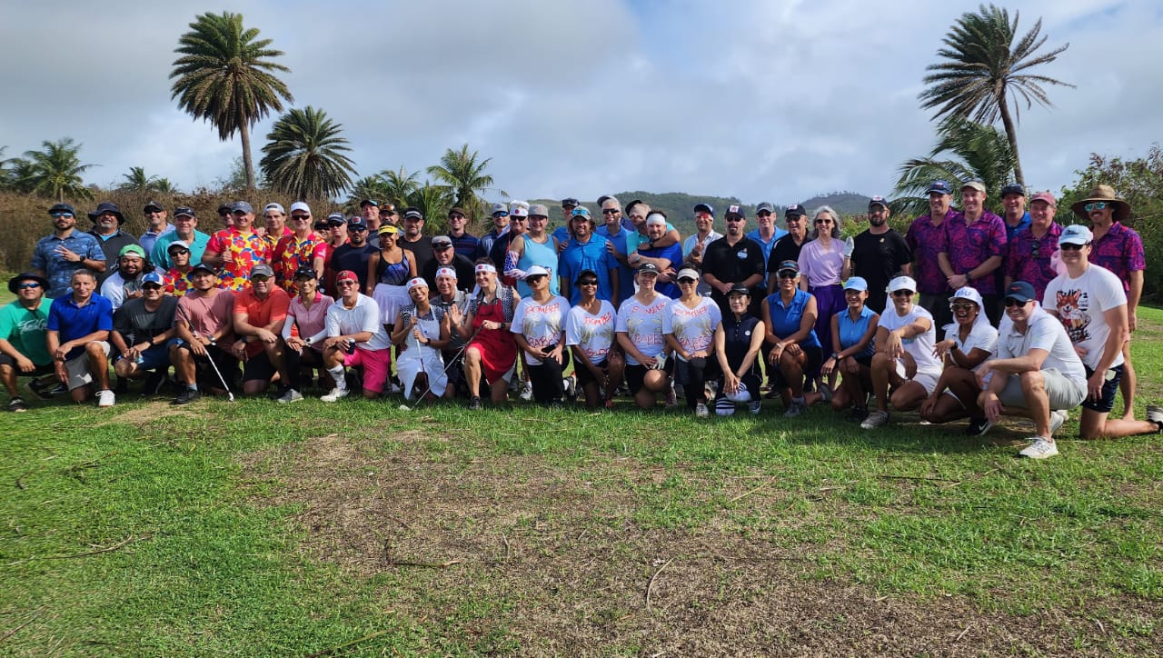 Participants in the 14th Wollak Golf Classic pose for a photo Sunday at the Kingfisher Golf Links.