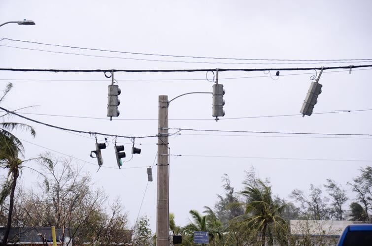 Traffic lights in Hagåtña hang battered and broken. Traffic lights throughout the island were left damaged in the aftermath of Typhoon Mawar. 