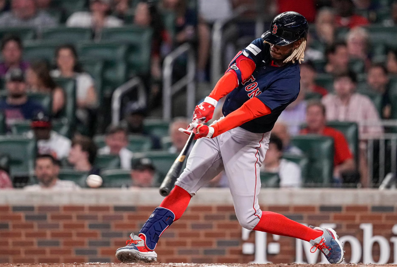 Boston Red Sox pinch hitter Raimel Tapia (17) hits a double to drive in a run against the Atlanta Braves during the seventh inning at Truist Park in Cumberland, Georgia, May 10, 2023.