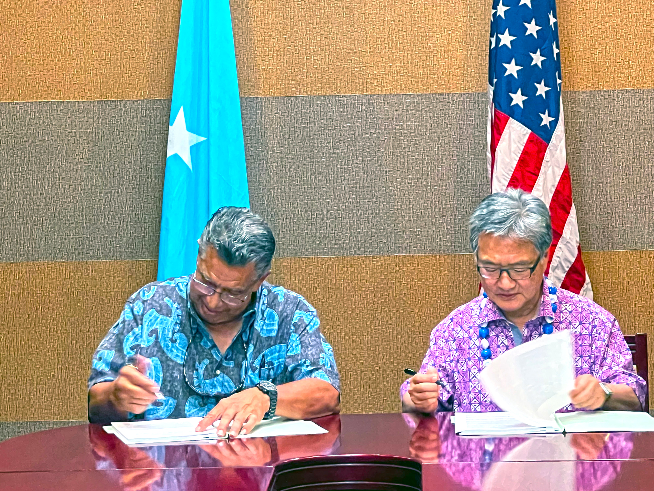 FSM Chief Negotiator Leo A. Falcom Jr., left, joins Special Presidential Envoy Joseph Yun on Monday this week in Pohnpei to initial a nearly final version of the new 20-year funding agreement for extending the Compact of Free Association.
