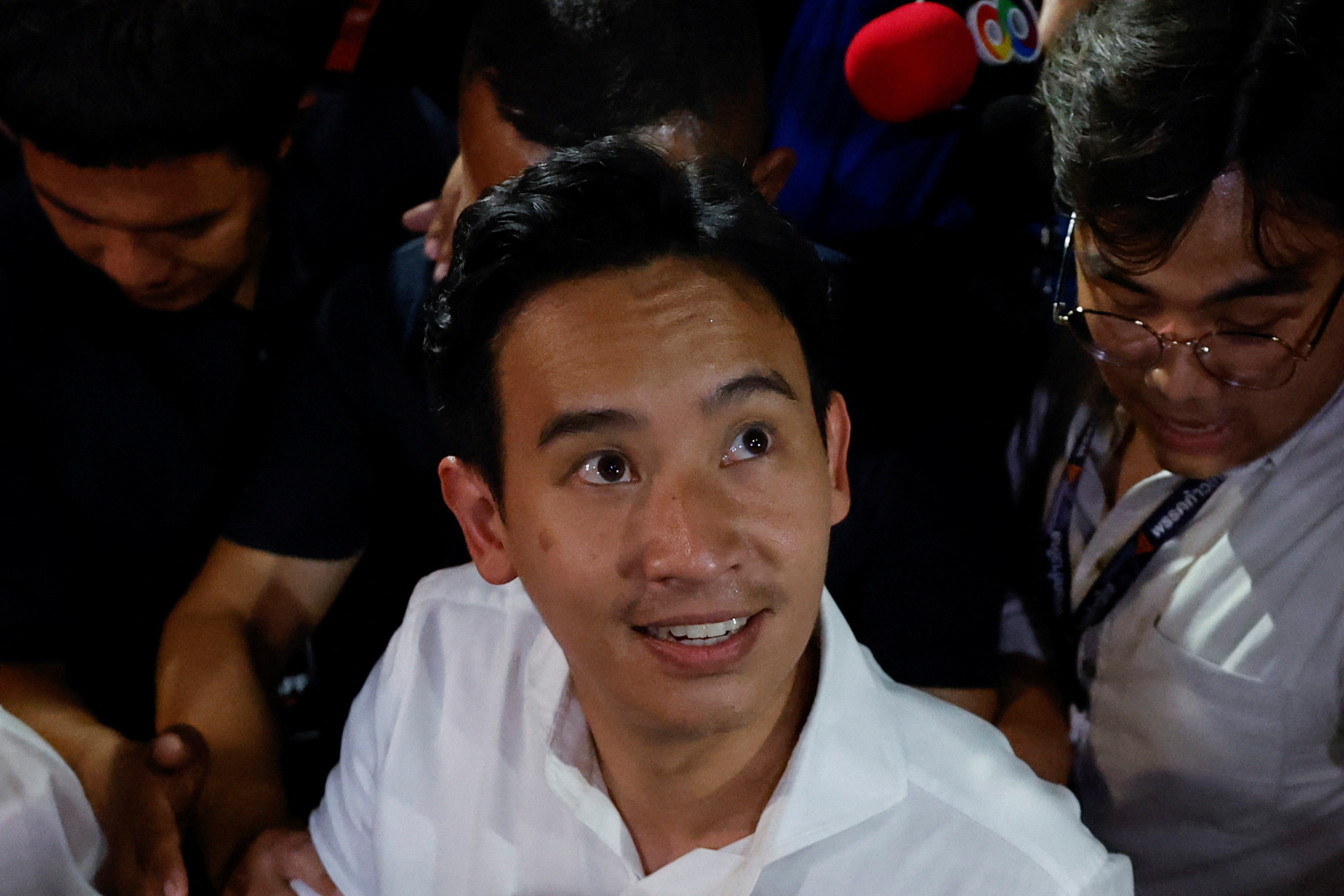 Move Forward Party leader and prime ministerial candidate, Pita Limjaroenrat, looks up at the crowd during the general election in Bangkok, Thailand, May 14, 2023. REUTERS/Jorge Silva