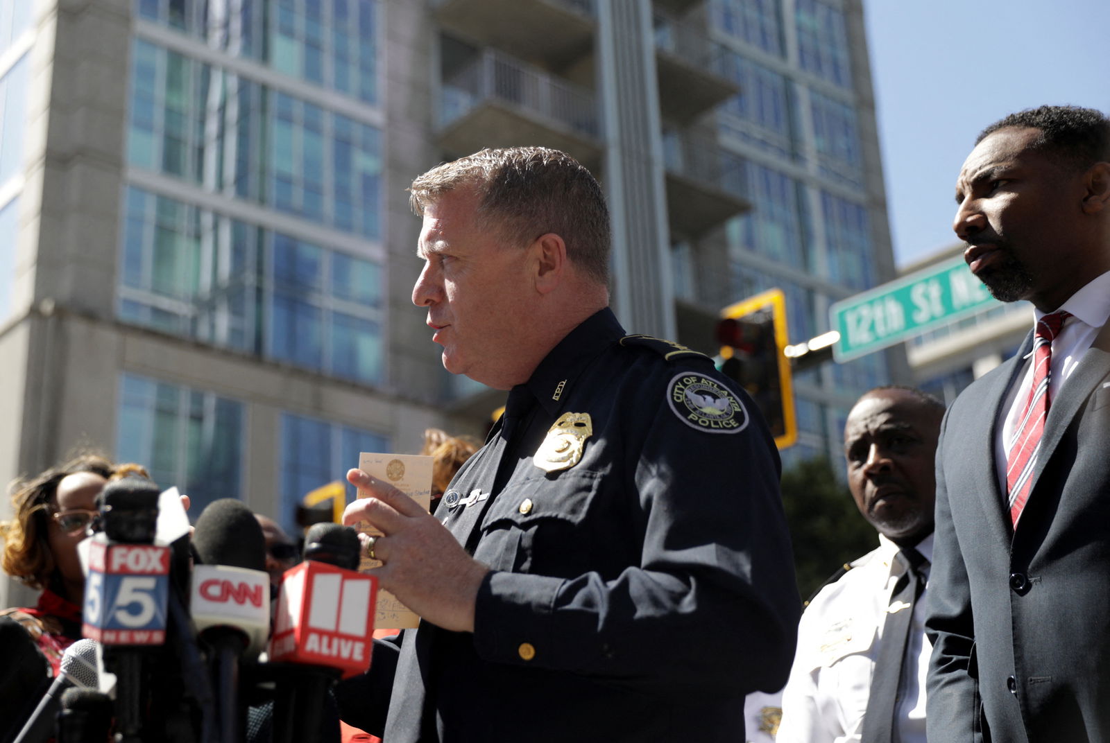 Atlanta Police Chief Darin Schierbaum delivers remarks next to Atlanta Mayor Andre Dickens as they attend a press conference after reports of several casualties from a gunman in a downtown hospital in Atlanta, Georgia, May 3, 2023. REUTERS/Alyssa Pointer