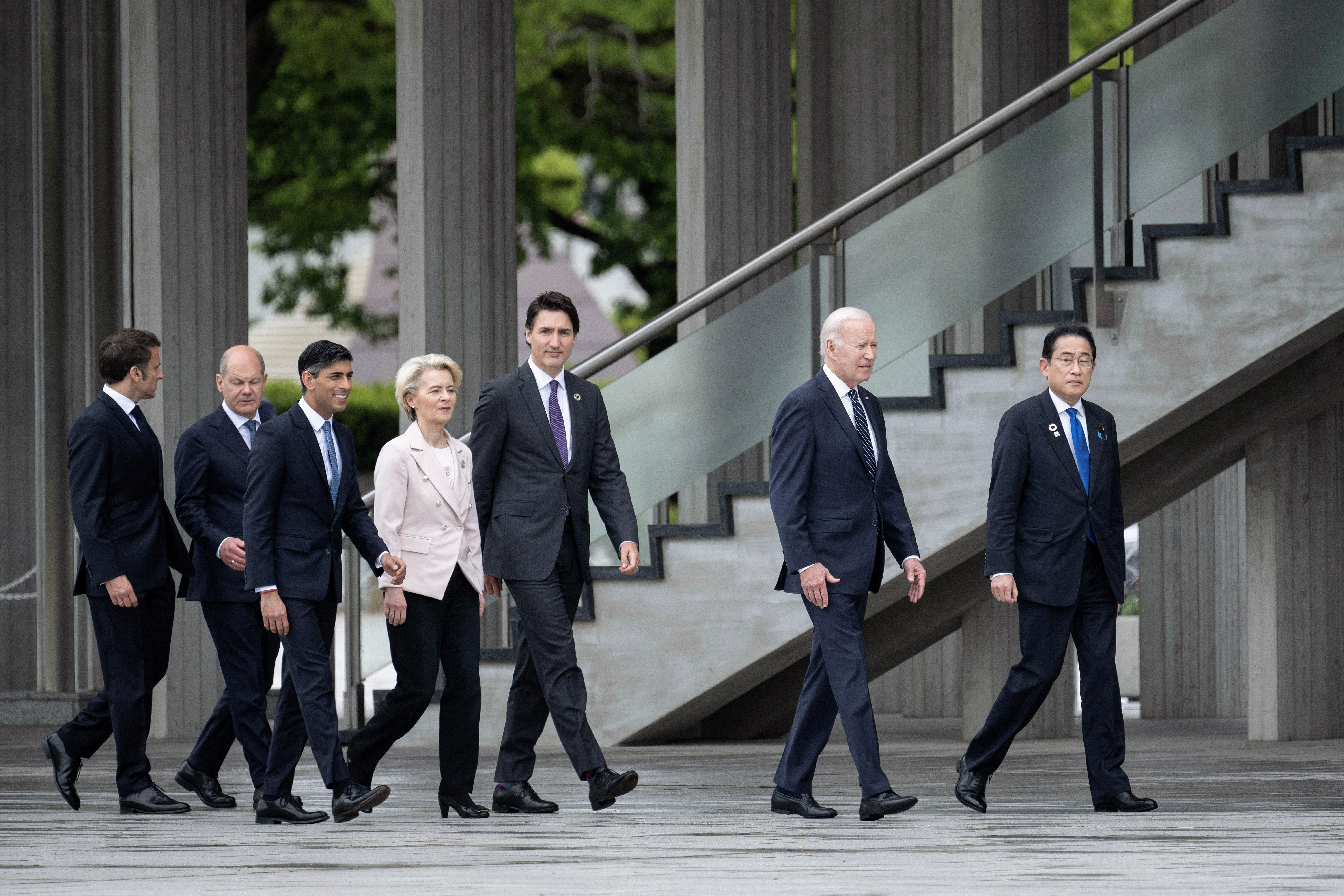 France's President Emmanuel Macron, Germany's Chancellor Olaf Scholz, Britain's Prime Minister Rishi Sunak, European Commission's President Ursula von der Leyen, Canada's Prime Minister Justin Trudeau, US President Joe Biden and Japan's Prime Minister Fumio Kishida visit the Peace Memorial Park as part of the G7 Leaders' Summit in Hiroshima on May 19, 2023. BRENDAN SMIALOWSKI/Pool via REUTERS