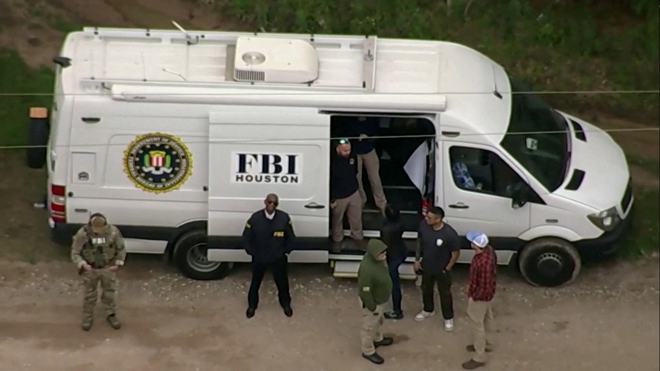 FILE PHOTO: An aerial view shows a Federal Bureau of Investigation (FBI) van where a search is being conducted for Francisco Oropeza, 38, who police say shot dead five neighbors in Cleveland, Texas, U.S. April 29, 2023 in a still image from video. ABC affiliate KTRK via REUTERS