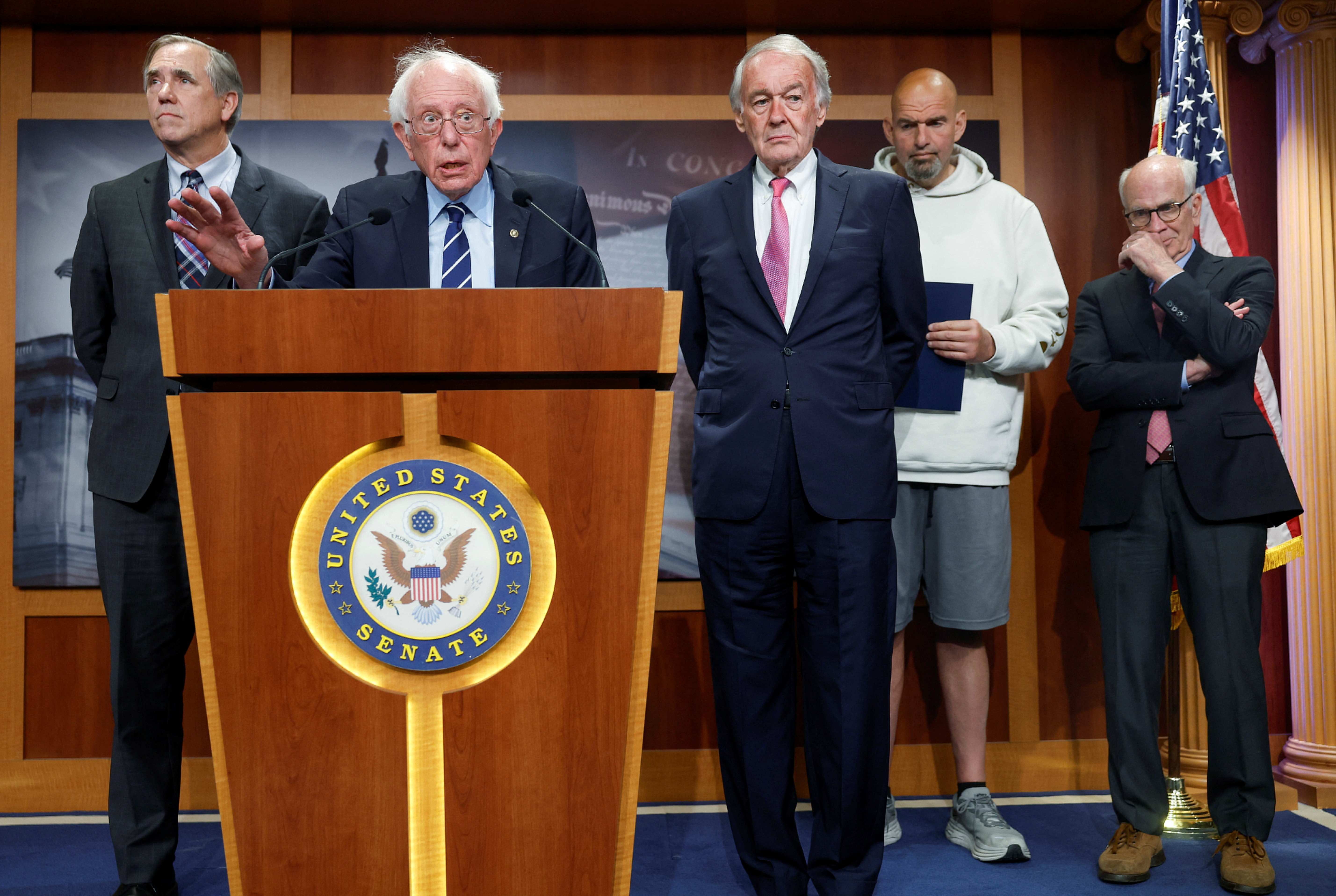 U.S. Senator Bernie Sanders, joined by Senators Jeff Merkley (D-OR), Edward Markey (D-MA), John Fetterman (D-PA), and Peter Welch (D-VT), speaks at a press conference on Capitol Hill about 11 Senate Democrats who sent a letter to President Joe Biden urging him to invoke the 14th Amendment to avoid a catastrophic debt default, in Washington, U.S., May 18, 2023. REUTERS/Evelyn Hockstein