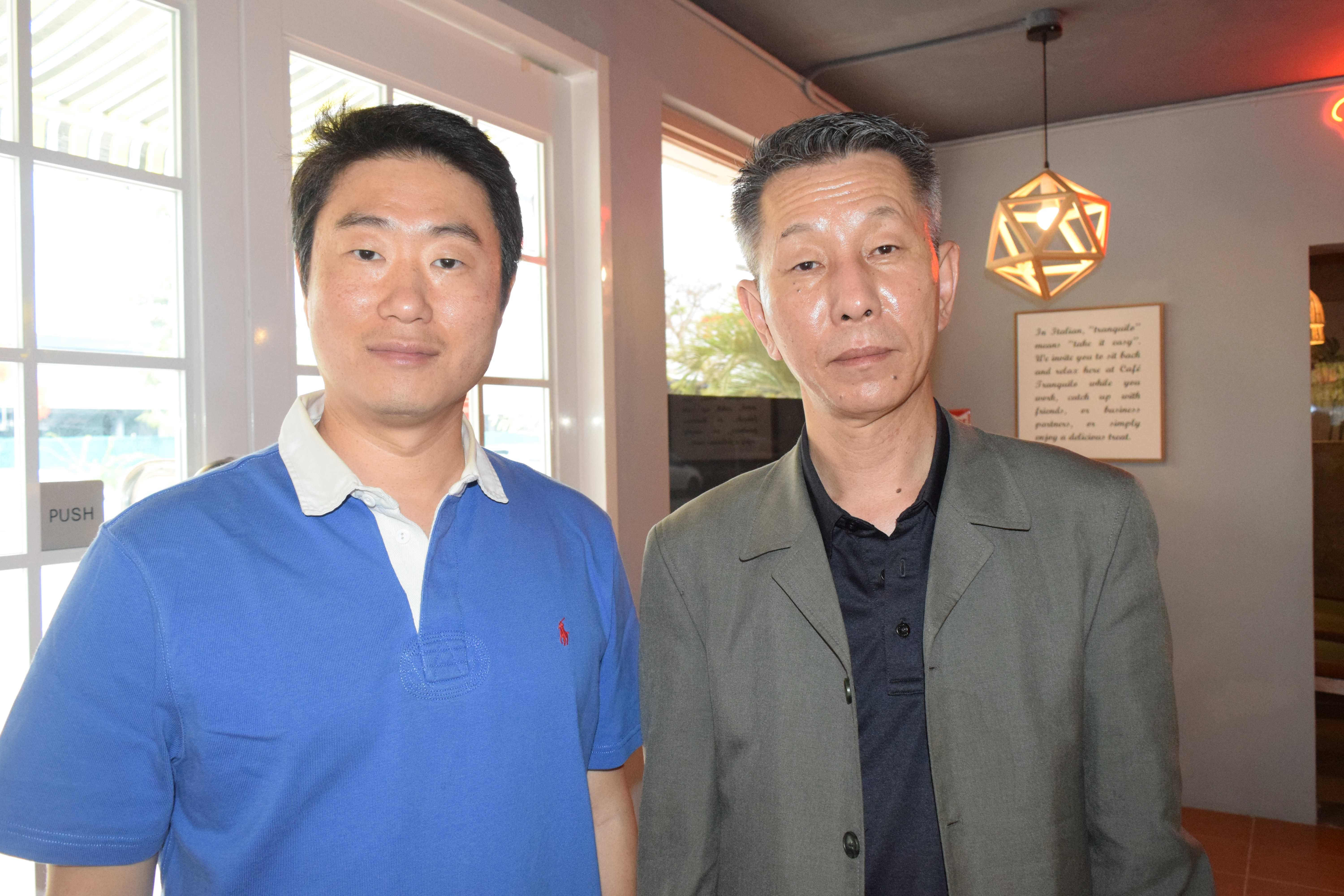 Kang Dong Orthopedic Hospital Vice President Sharky Kang, left, and International Healthcare Director Hyun Bong "Shon" Park pose for a photo after seeing one of their patients in Garapan on Tuesday. 