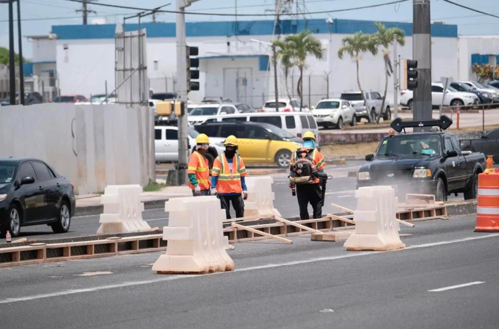 A Dooall Construction Co. crew works on a median restoration project Friday, May 19, 2023, on Route 1 in Tamuning.