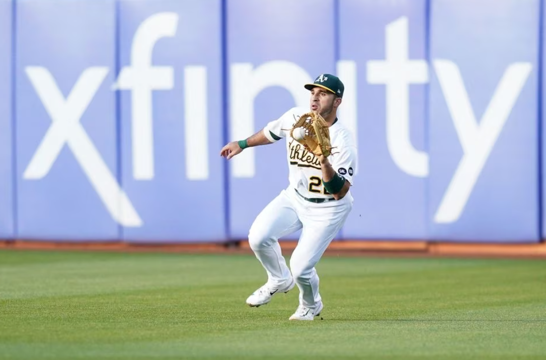 Oakland Athletics right fielder Ramon Laureano (22) fields the ball against the Tampa Bay Rays in the third inning at Oakland-Alameda County Coliseum in Oakland, California,  June 12, 2023.