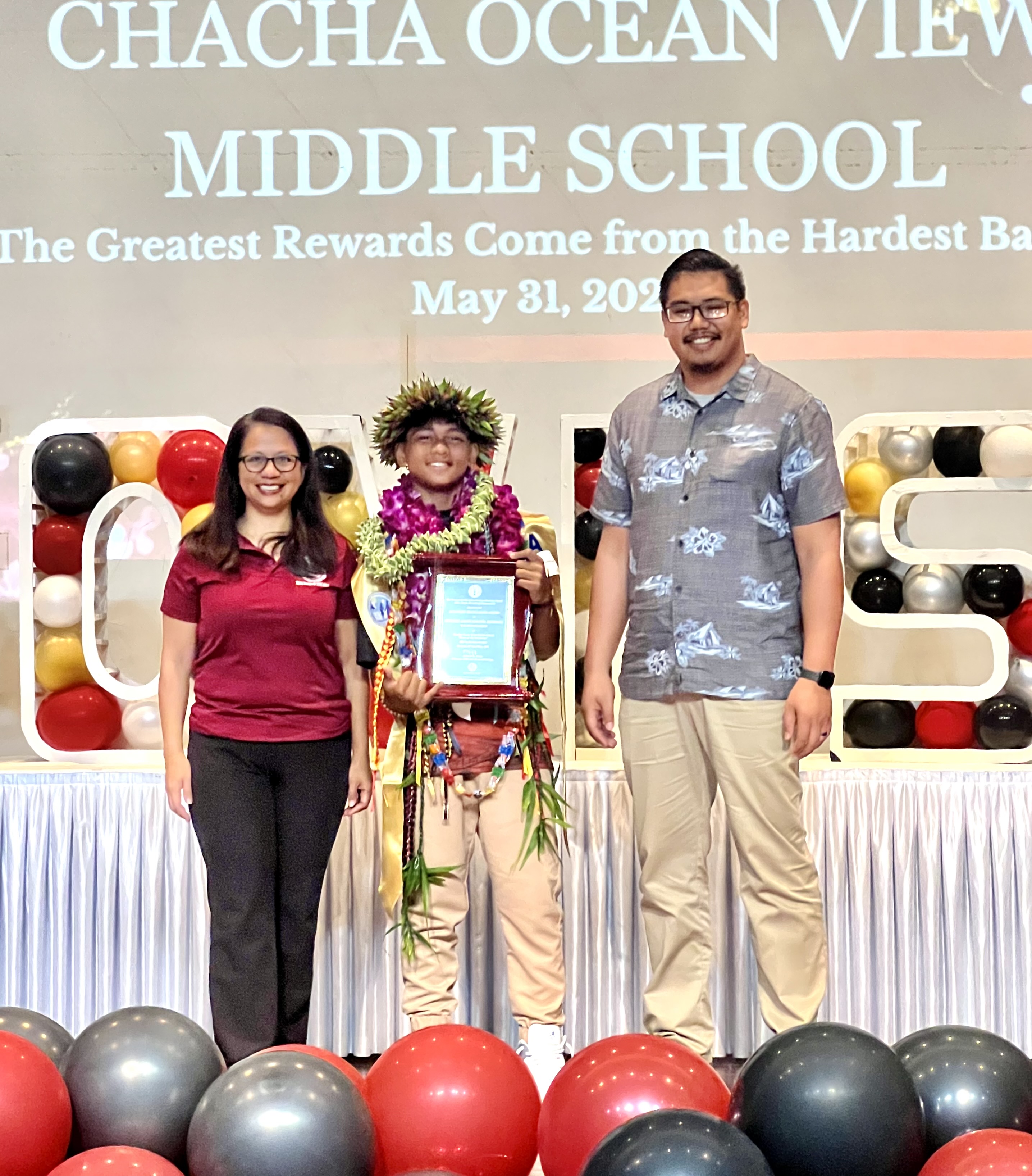 Valedictorian and Board of Education Academic Award recipient Gregorio Joseph Magofna Rodriguez, center, with BOE Chairman Antonio L. Borja, right, and BOE Member Maisie B. Tenorio.