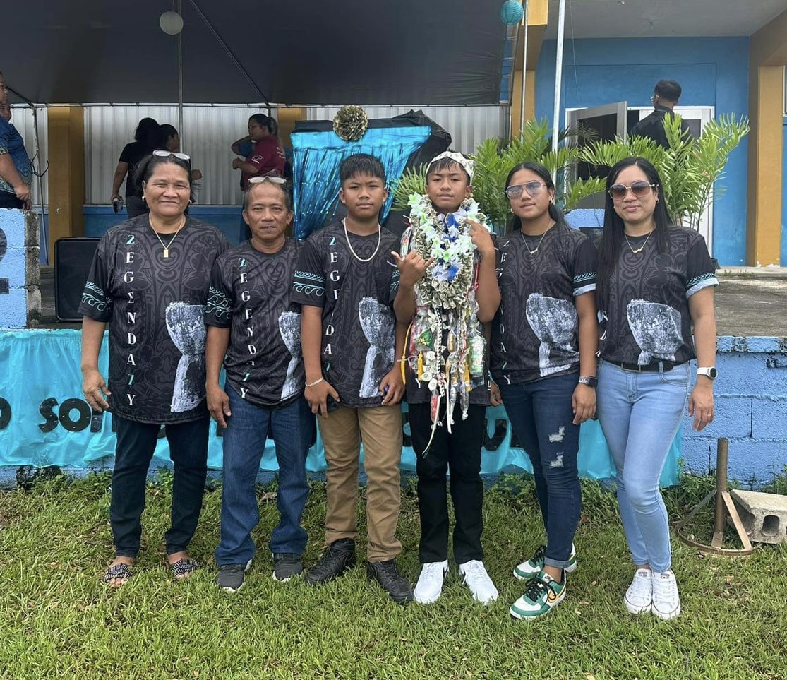 Genaro Gonzales Mejia III, the class valedictorian, with his parents and siblings.