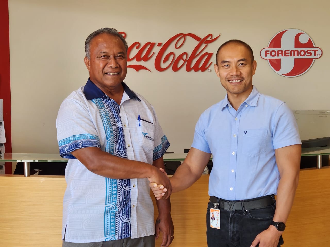 Marcos W. Fong, right, CEO of Coca-Cola Beverage Co. (Micronesia) Inc. and Foremost Foods Inc., and Ramon “Ray” Tebuteb, president of the Northern Marianas Athletics, seal with a handshake the beverage companies’ commitment to be the official beverage partners of the 2023 Oceania Athletics Cup and Oceania Masters Championships that Saipan is hosting from June 22 to 26, 2023.