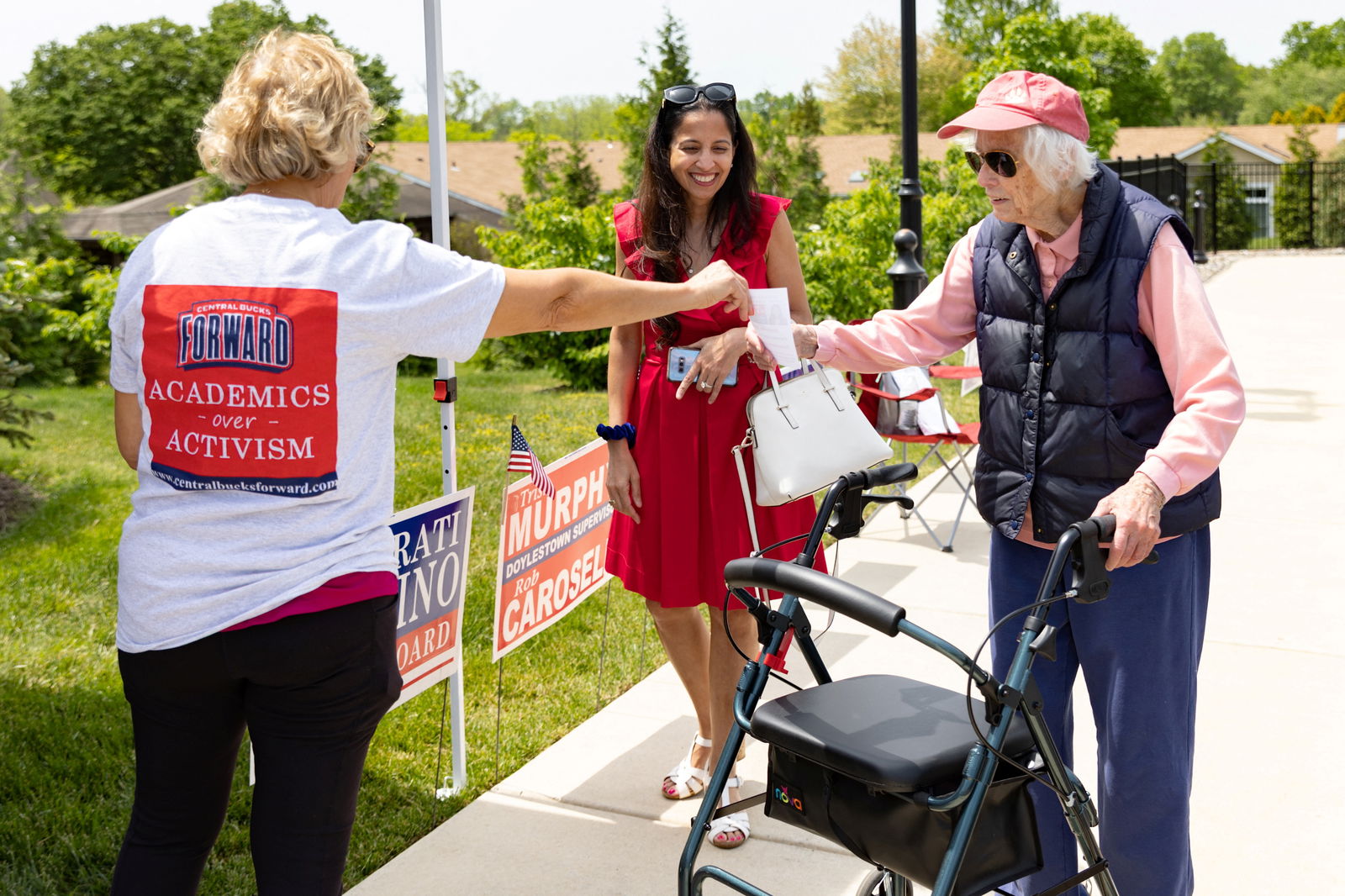 Aarati Martino, who is running for Central Bucks School Board, speaks to a volunteer at a polling location during the Primary Election Day in Doylestown, Pennsylvania, U.S., May 16, 2023. REUTERS/Hannah Beier
