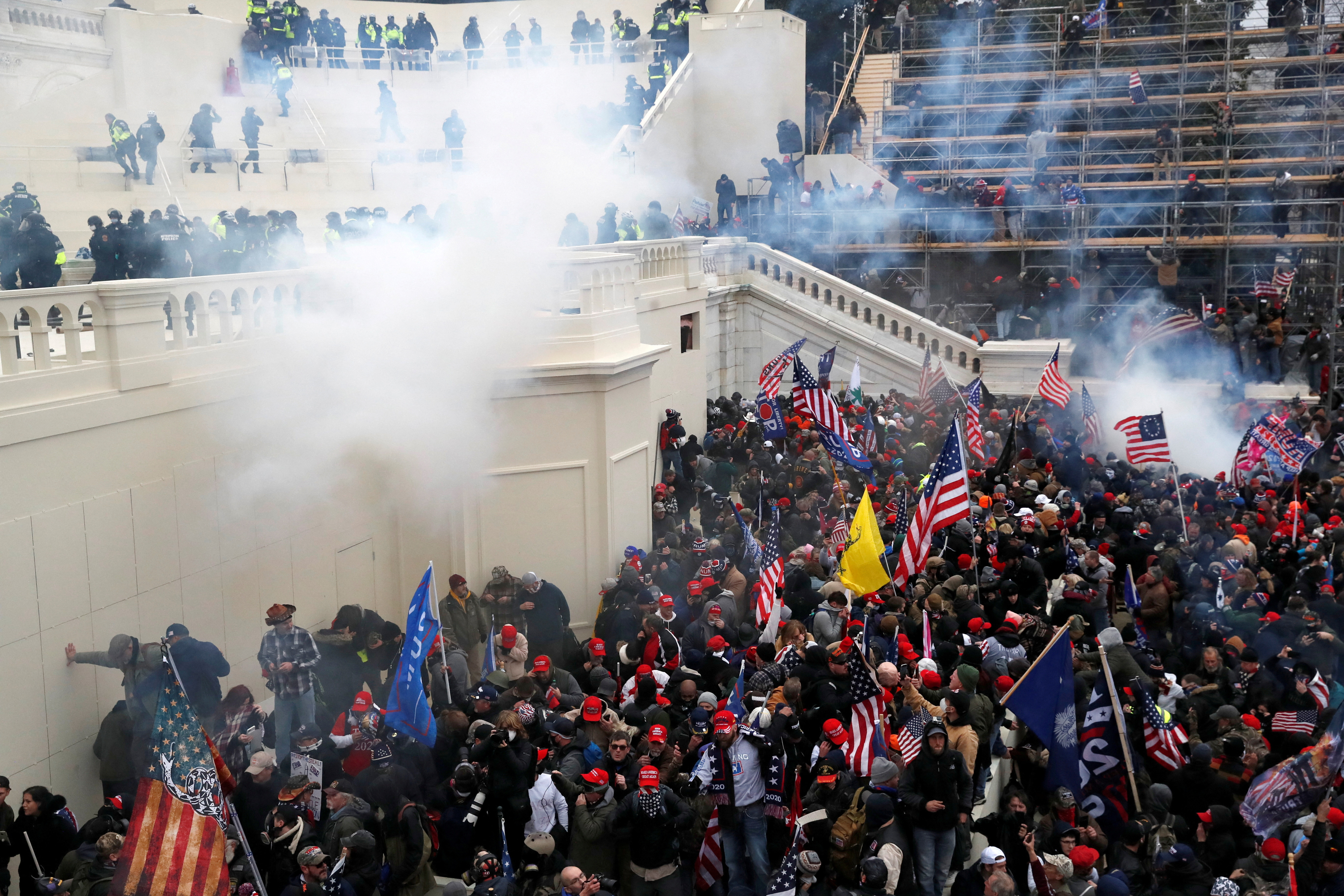 FILE PHOTO: Police release tear gas into a crowd of pro-Trump protesters during clashes at a rally to contest the certification of the 2020 U.S. presidential election results by the U.S. Congress, at the U.S. Capitol Building in Washington, U.S, January 6, 2021. REUTERS/Shannon Stapleton