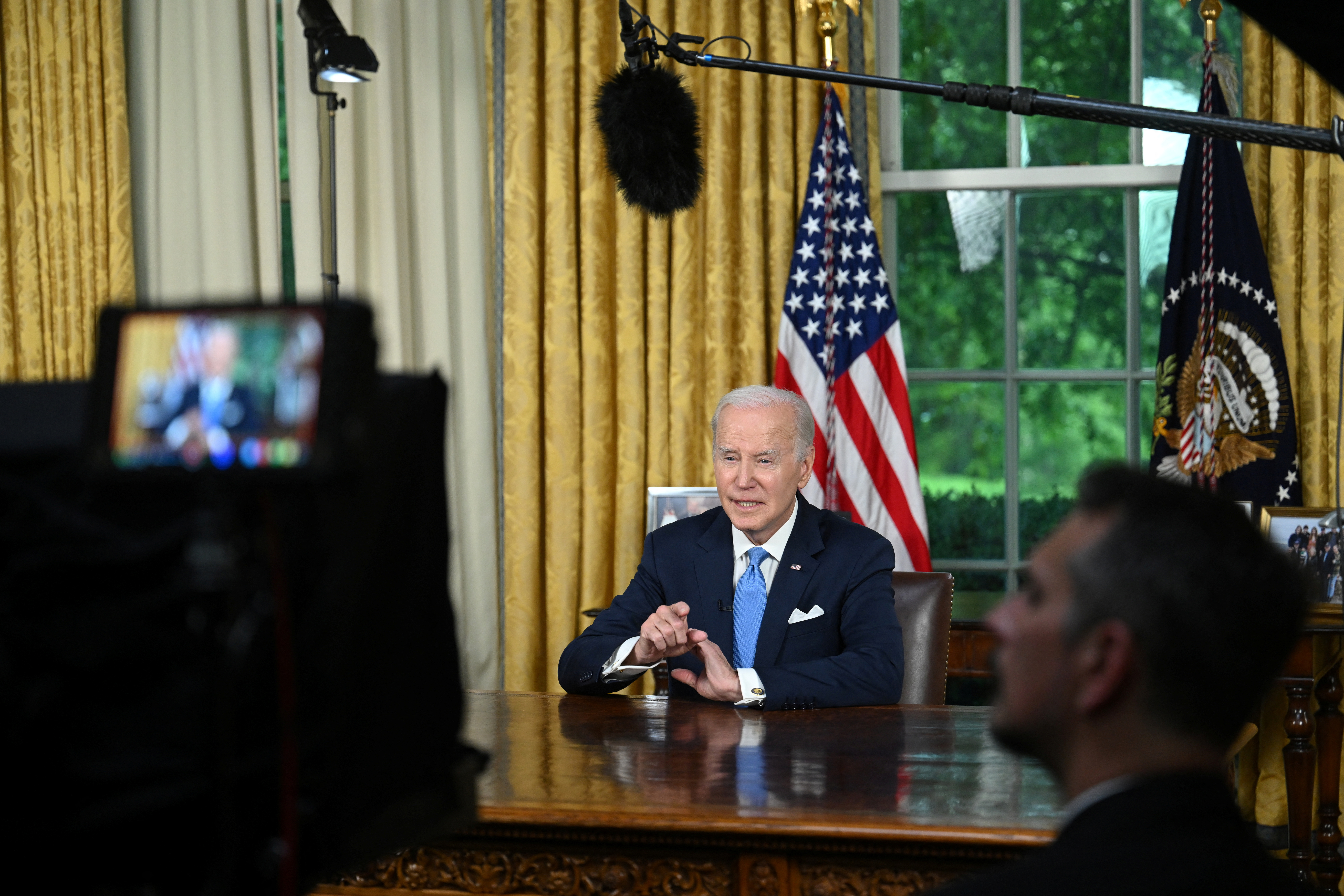 US President Joe Biden addresses the nation on averting default and the Bipartisan Budget Agreement, in the Oval Office of the White House in Washington, DC, June 2, 2023. JIM WATSON/Pool via REUTERS