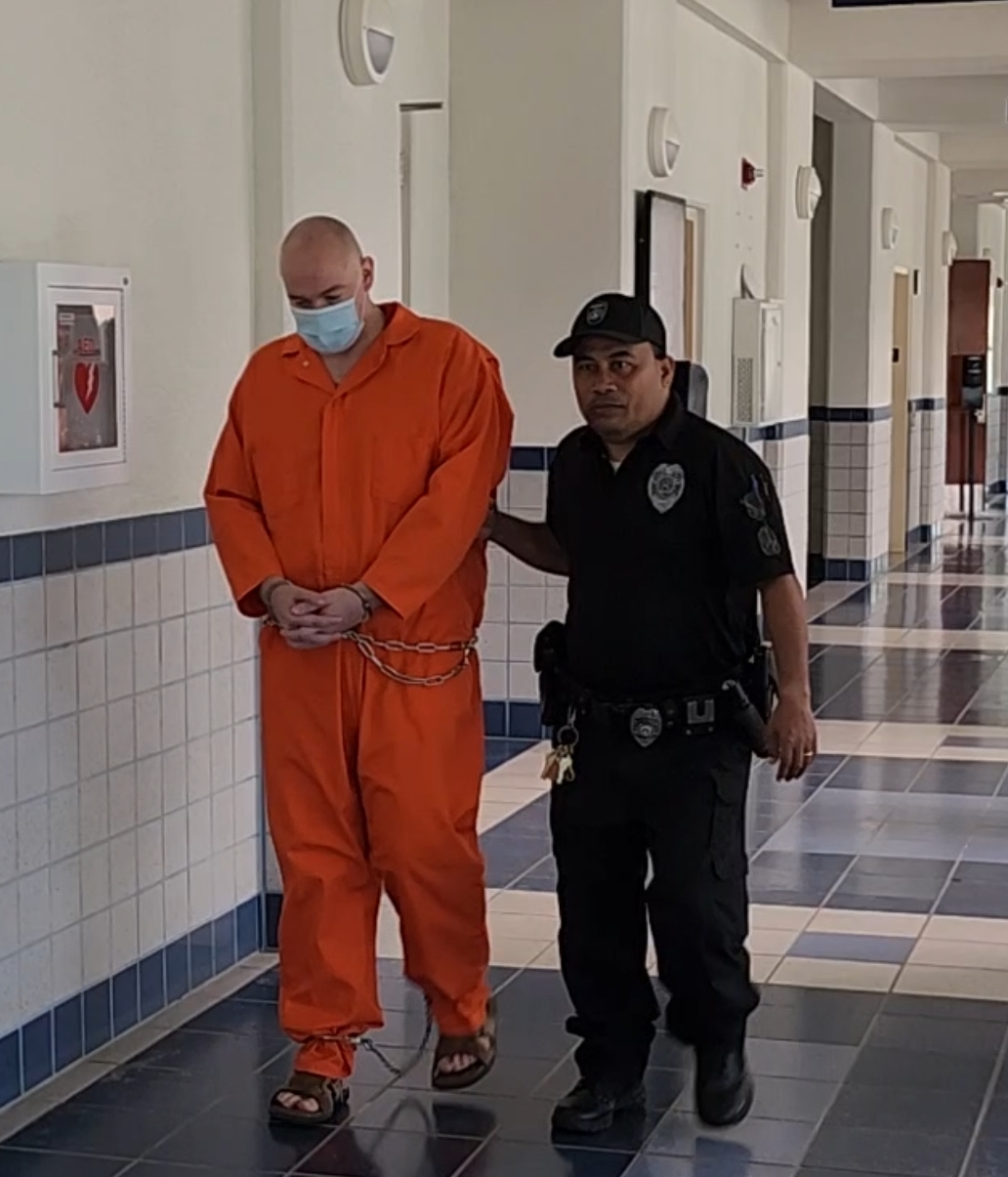 William Abraczinkas, left, is escorted by a Corrections officer to a courtroom for a bail hearing on Friday.