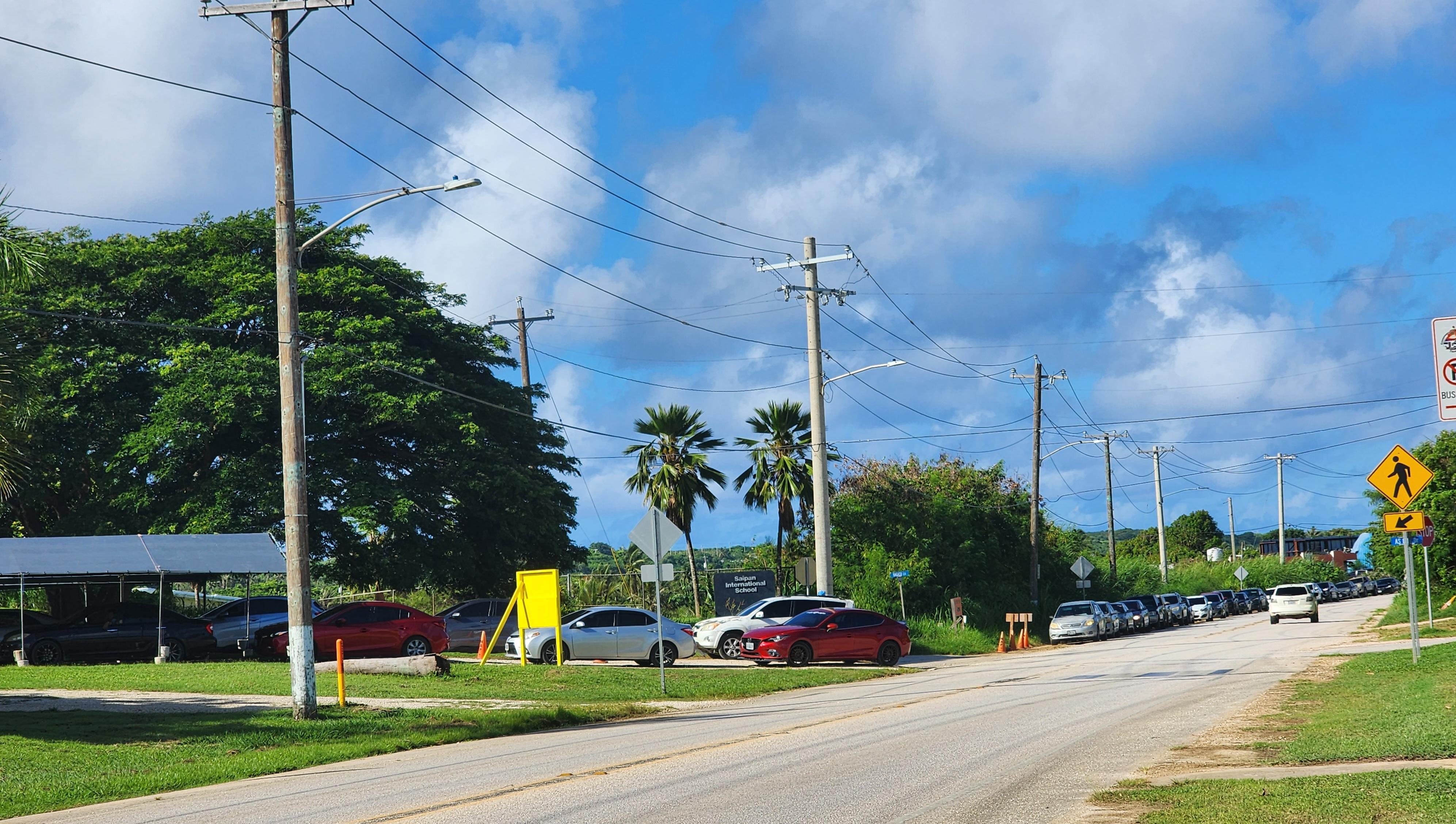 Vehicles started lining up for the P-EBT summer drive-thru distribution as early as 7 a.m. at the NAP office in As Lito on Wednesday.