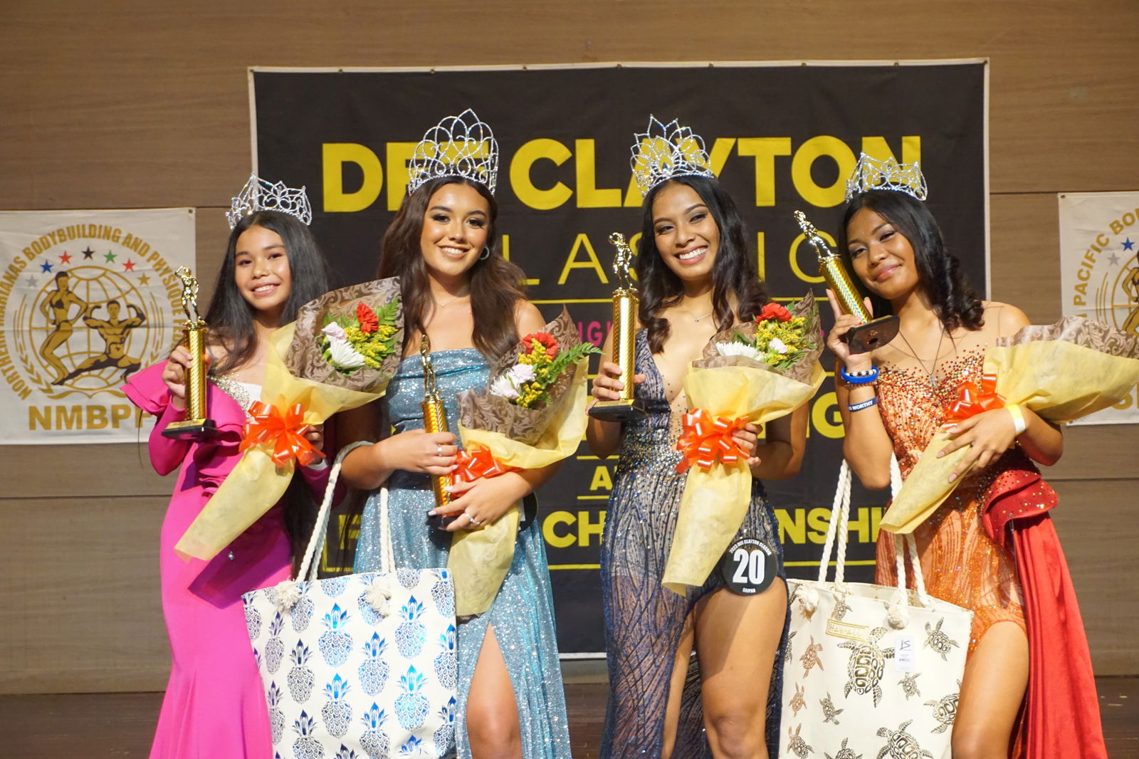 The participants of this year’s  Dee Clayton Classic & Northern Marianas Bodybuilding Federation fitness pageant pose with their trophies Saturday at Saipan World Resort.