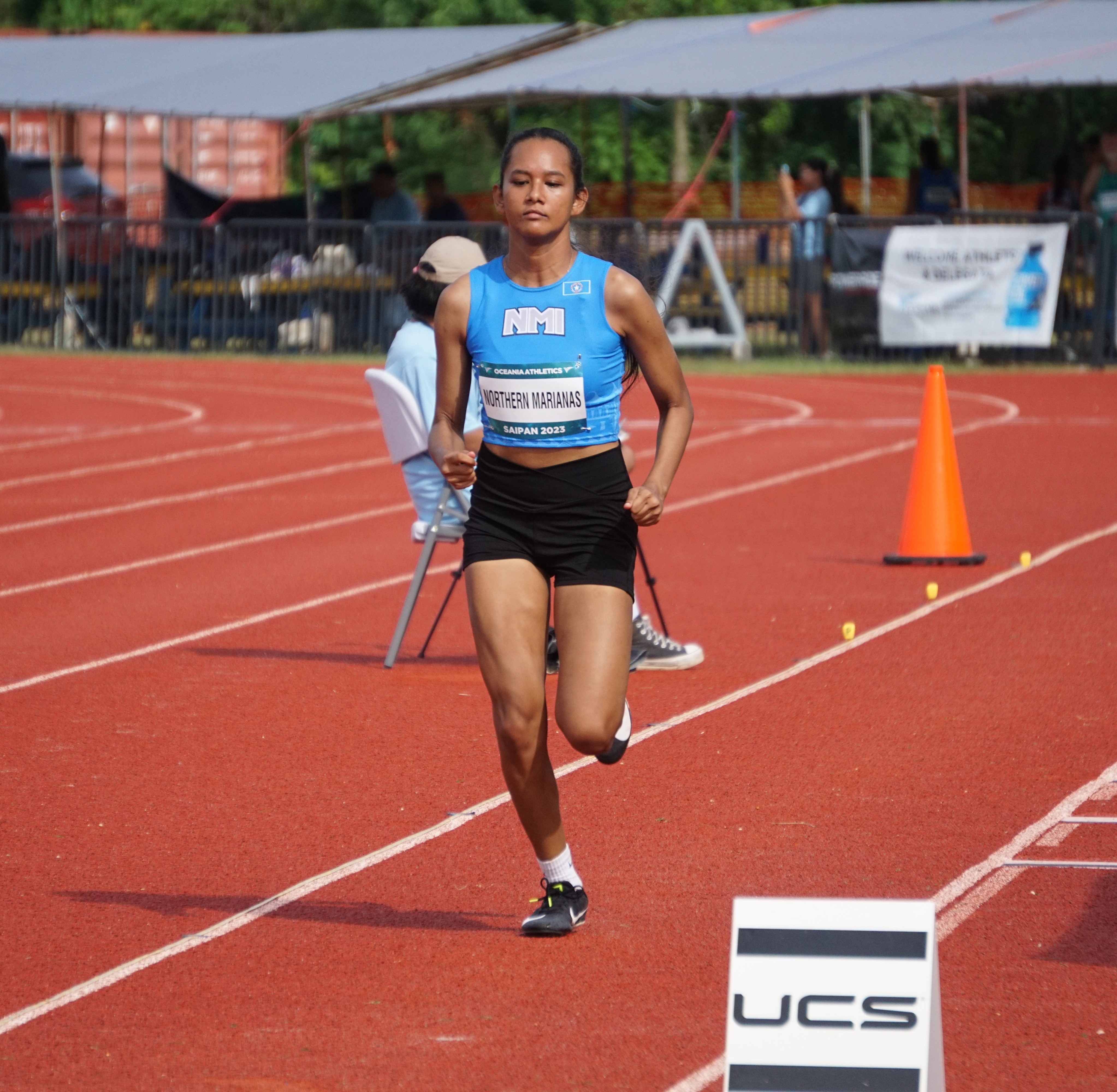 Colleen Cruz gathers for the long jump event.