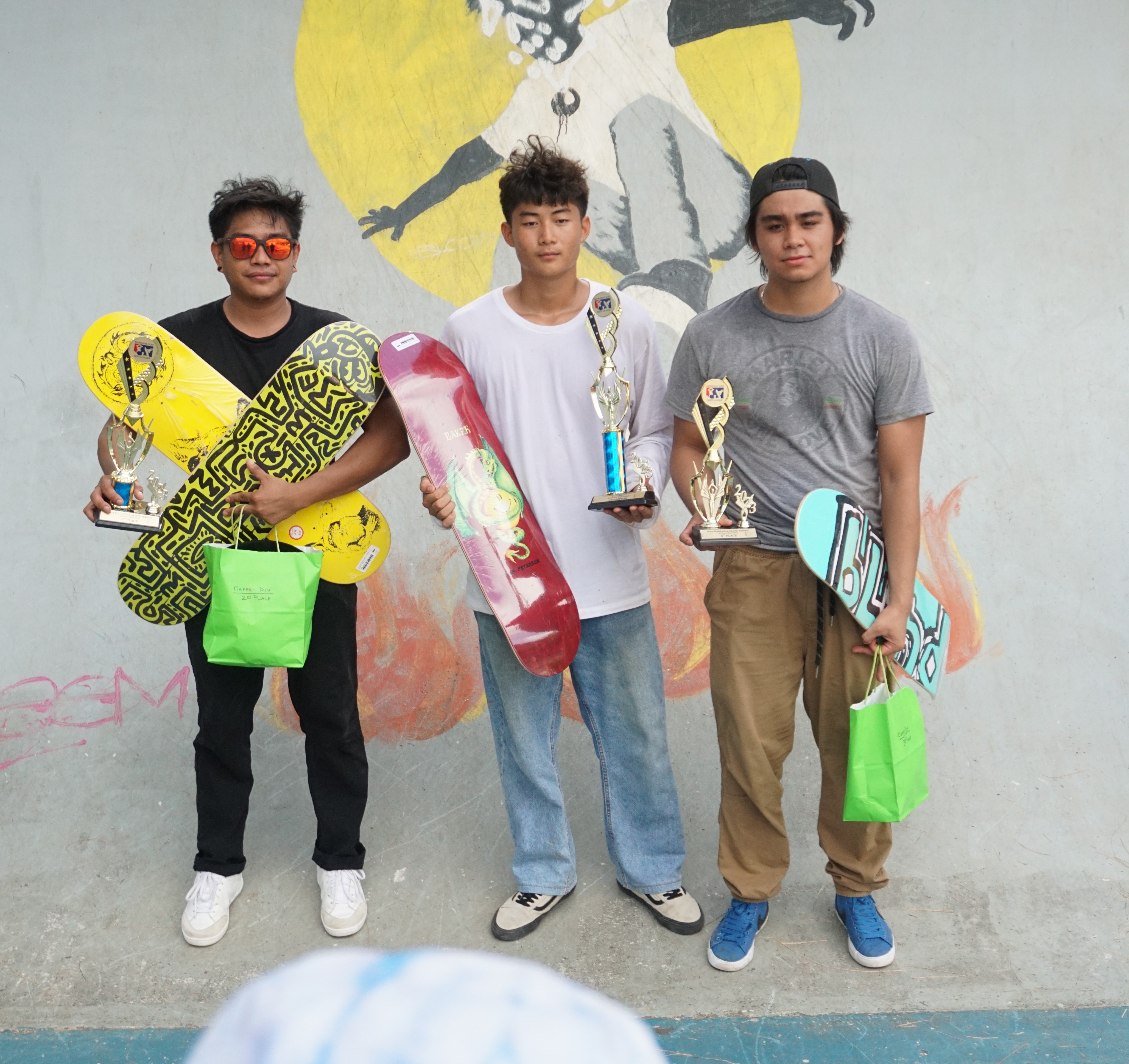 Kevin Codog, Sean Gil and Miles Borja pose with their trophies and brand new boards as the top three skateboarders of the 1st annual Marianas Skate Series at Garapan Skate Park on Saturday. 