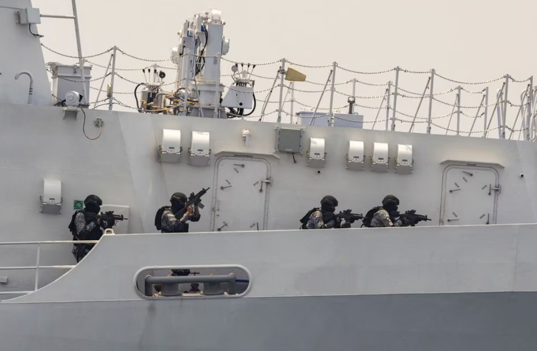 Members of the Philippine Coast Guard on board of BRP Melchora Aquino (MRRV-9702) participate in a simulation exercise to improve search and rescue collaboration, and enforcement during the first trilateral coast guard exercise between the Philippines, Japan, and the U.S., at the coast of Bataan, Philippines in the South China Sea, June 6, 2023.