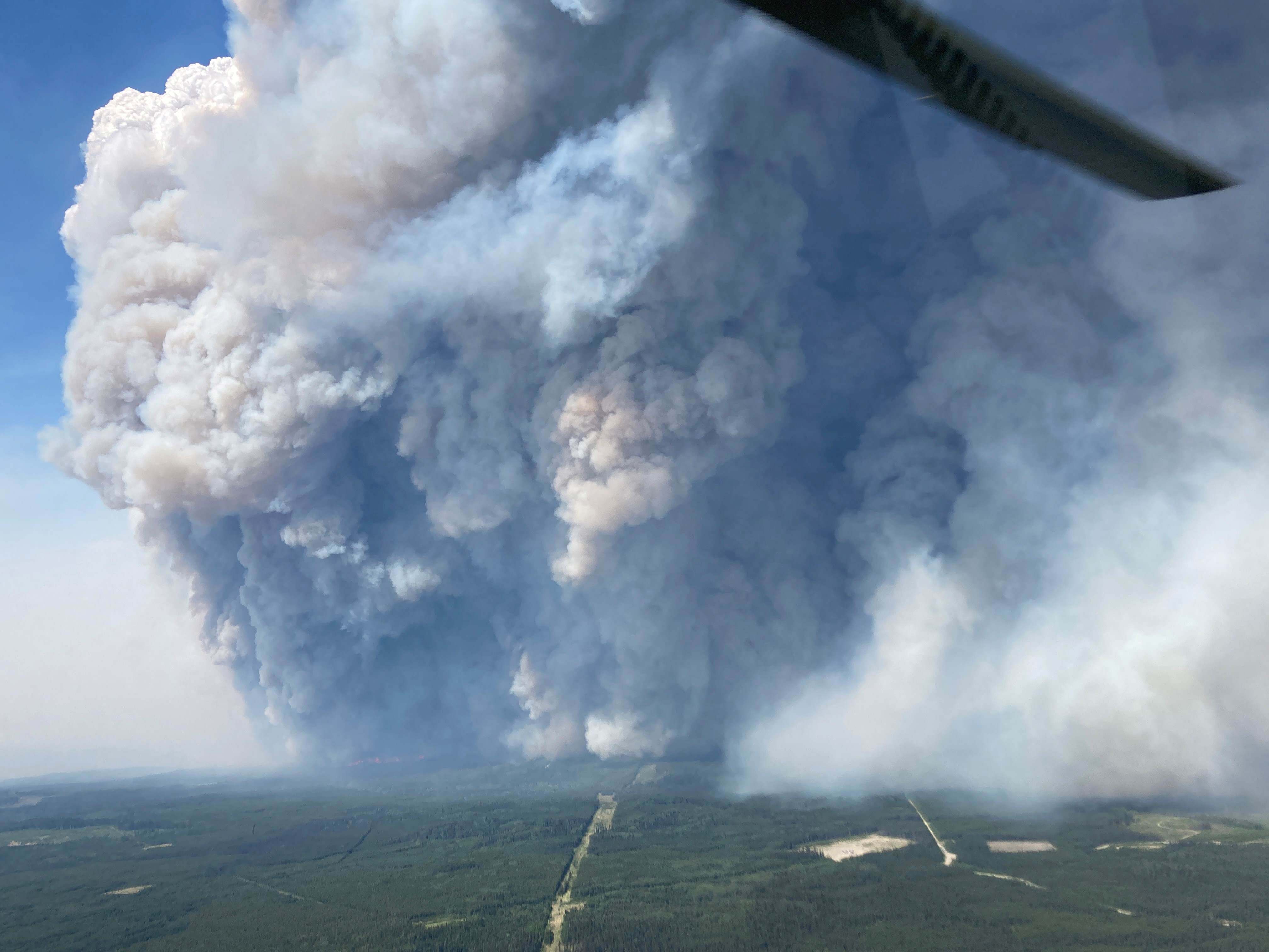 Smoke billows upwards from the Donnie Creek wildfire (G80280) south of Fort Nelson, British Columbia, Canada June 11, 2023. B.C. Wildfire Service/Handout via REUTERS