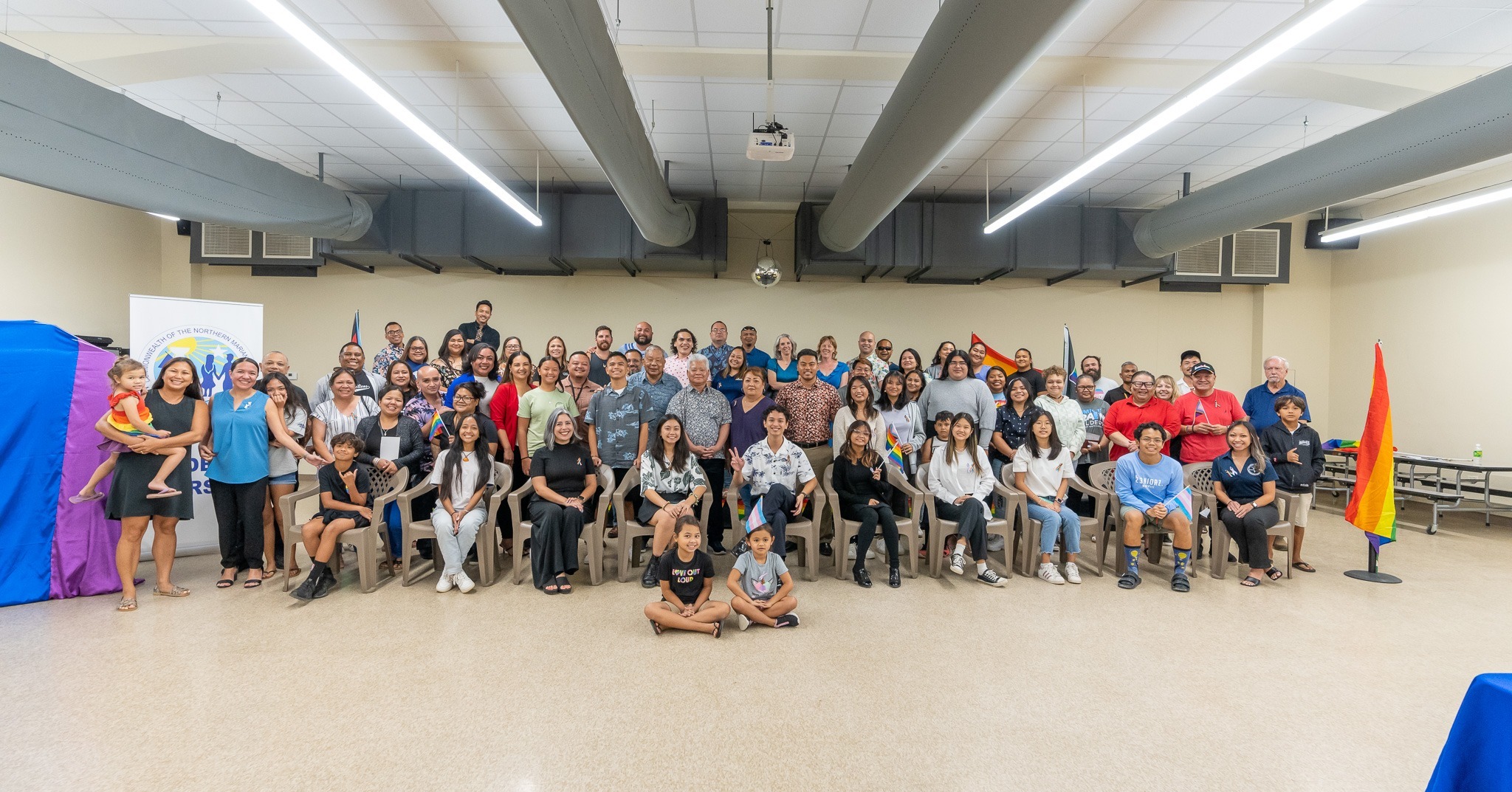 Gov. Arnold I. Palacios, Lt. Gov. David Apatang and Speaker Edmund S. Villagomez pose for a photo with other officials, advocates, students and community members following the proclamation of June as CNMI Pride Month on Thursday, June 1, 2023.