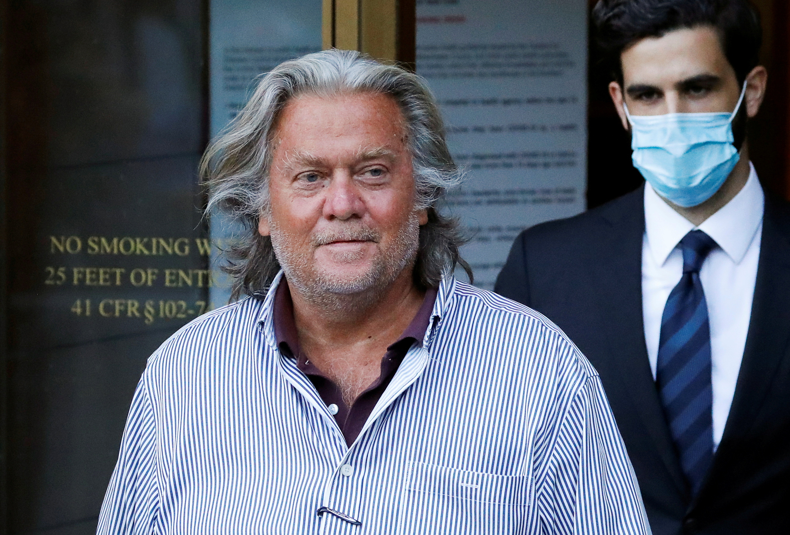 FILE PHOTO: Former White House Chief Strategist Steve Bannon exits the Manhattan Federal Court, following his arraignment hearing for conspiracy to commit wire fraud and conspiracy to commit money laundering, in the Manhattan borough of New York City, New York, U.S. August 20, 2020. REUTERS/Andrew Kelly