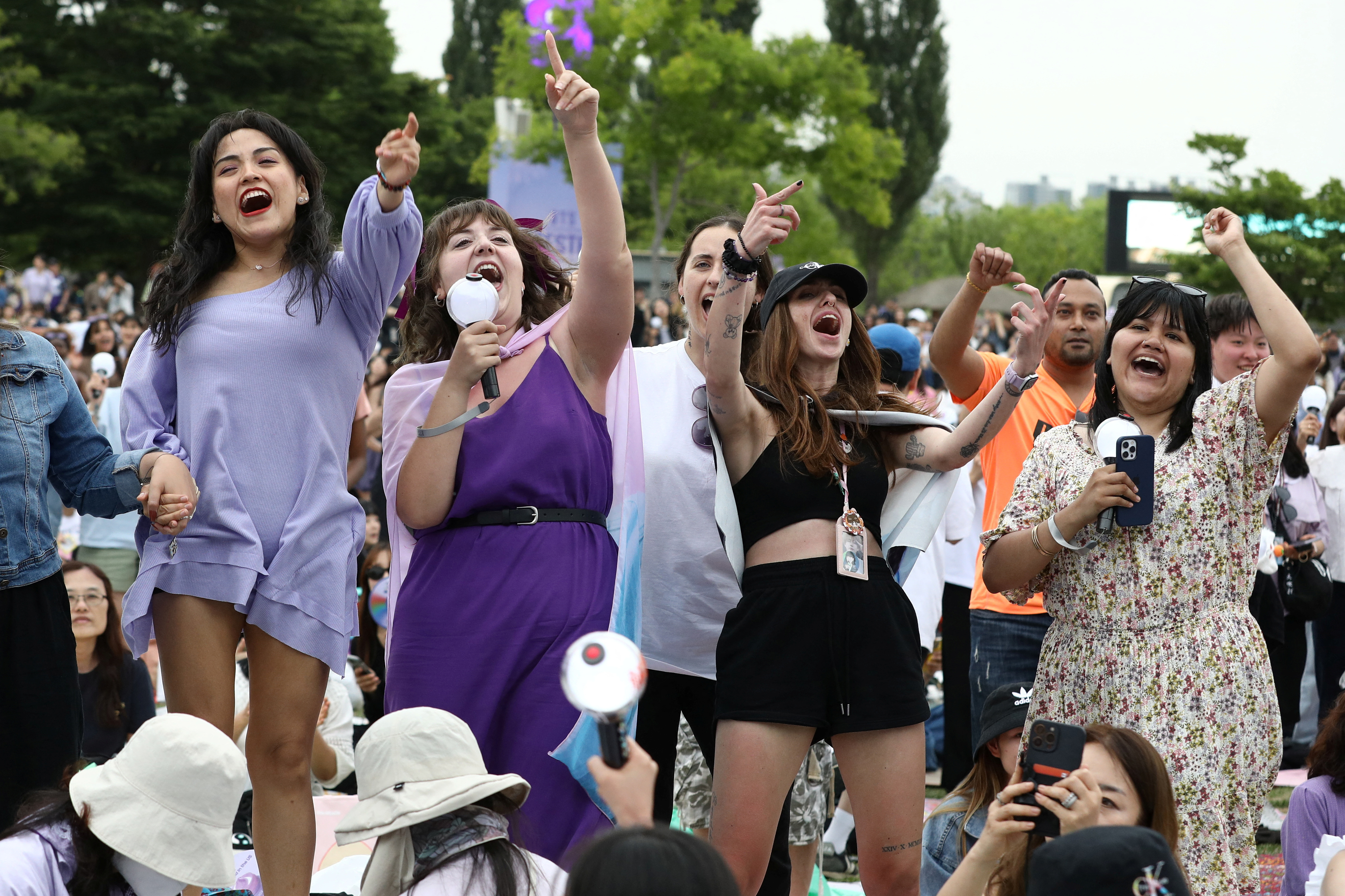 Fans of the K-pop boy band BTS react as they listen to the BTS member RM's radio show during BTS 10th Anniversary FESTA in Seoul, South Korea, June 17, 2023. REUTERS/Kim Soo-hyeon