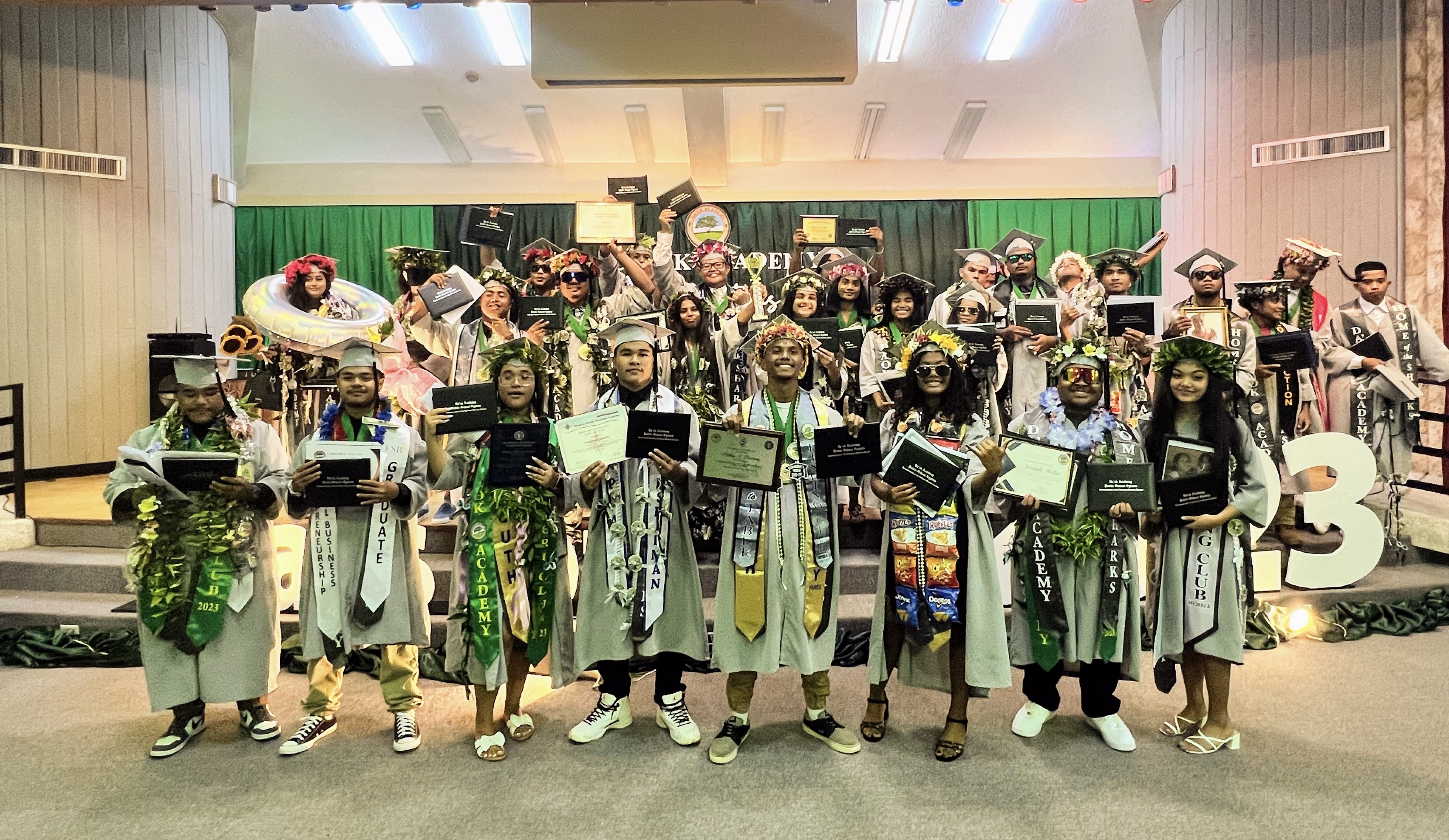 The 31 graduates of Da’ok Academy’s Class of 2023  display their certificates, trophies and medals following their commencement ceremony on Monday, June 5, 2023 at the Gov. Pedro P. Tenorio Multi-Purpose Center. 