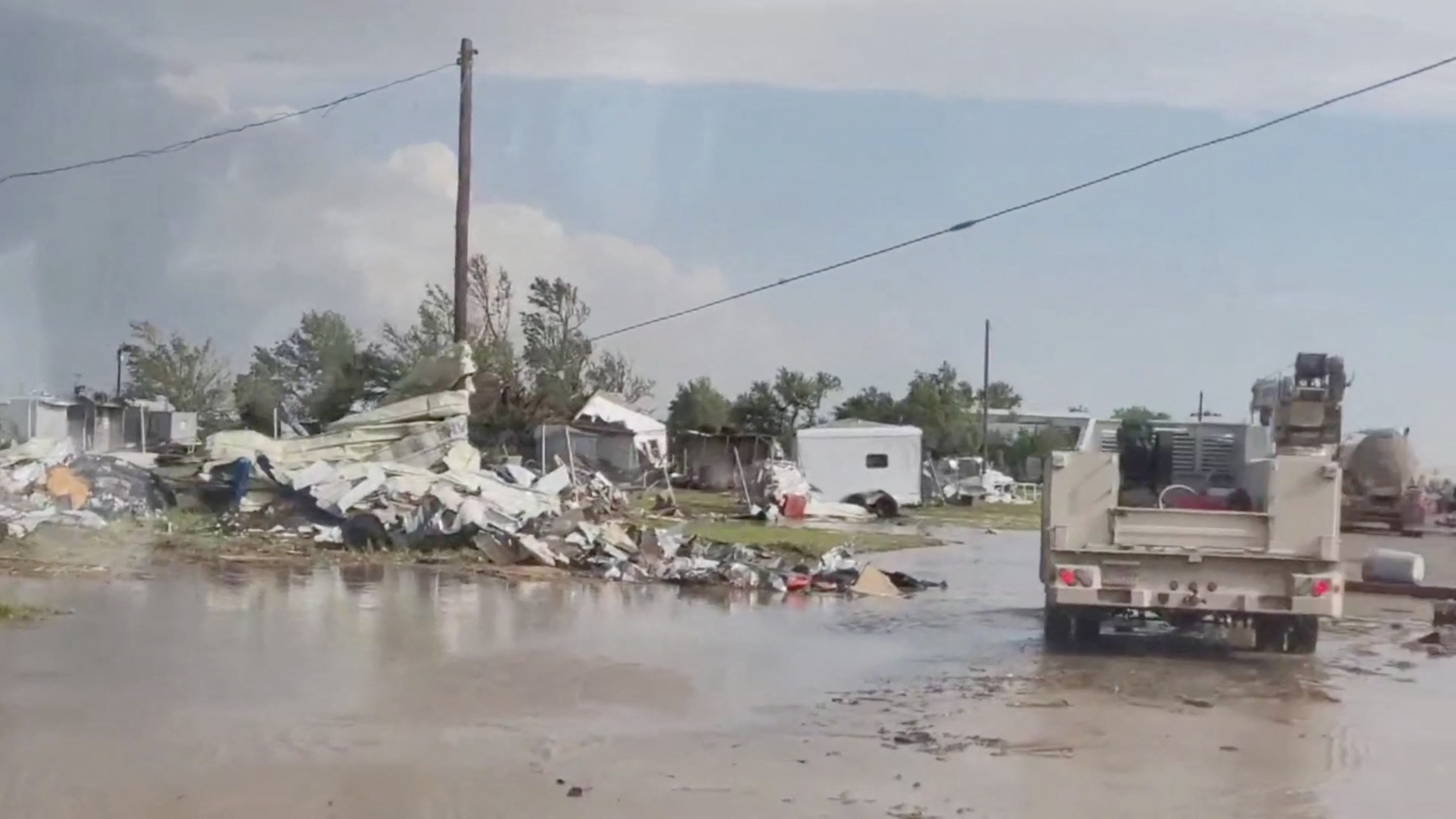 A view of a damaged site in Perryton as the town gets struck by a tornado, in Texas, U.S. June 15, 2023, in this screengrab obtained from a social media video. Sabrina Devers via TMX/via REUTERS