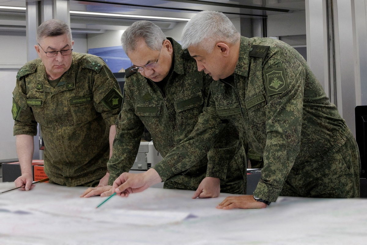 Russian Defence Minister Sergei Shoigu and Colonel General Yevgeny Nikiforov (R), commander of troops of the Western Military District, visit the advanced control post of Russian troops involved in Russia-Ukraine conflict, at an unknown location, in this picture released June 26, 2023. Russian Defence Ministry/Handout via REUTERS