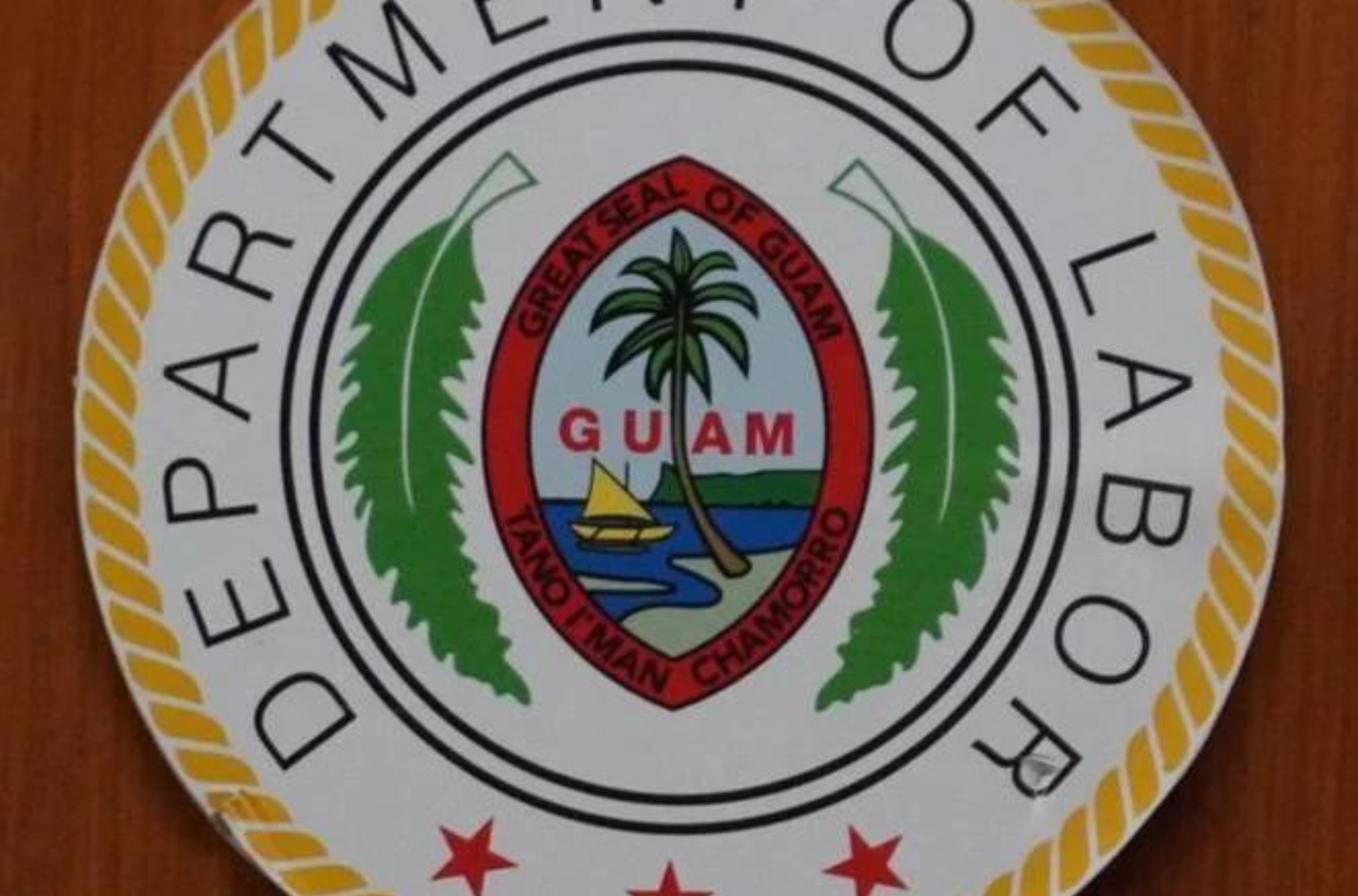 The seal of the Guam Department of Labor is seen on the door to its Hagåtña offices on March 16, 2023. 