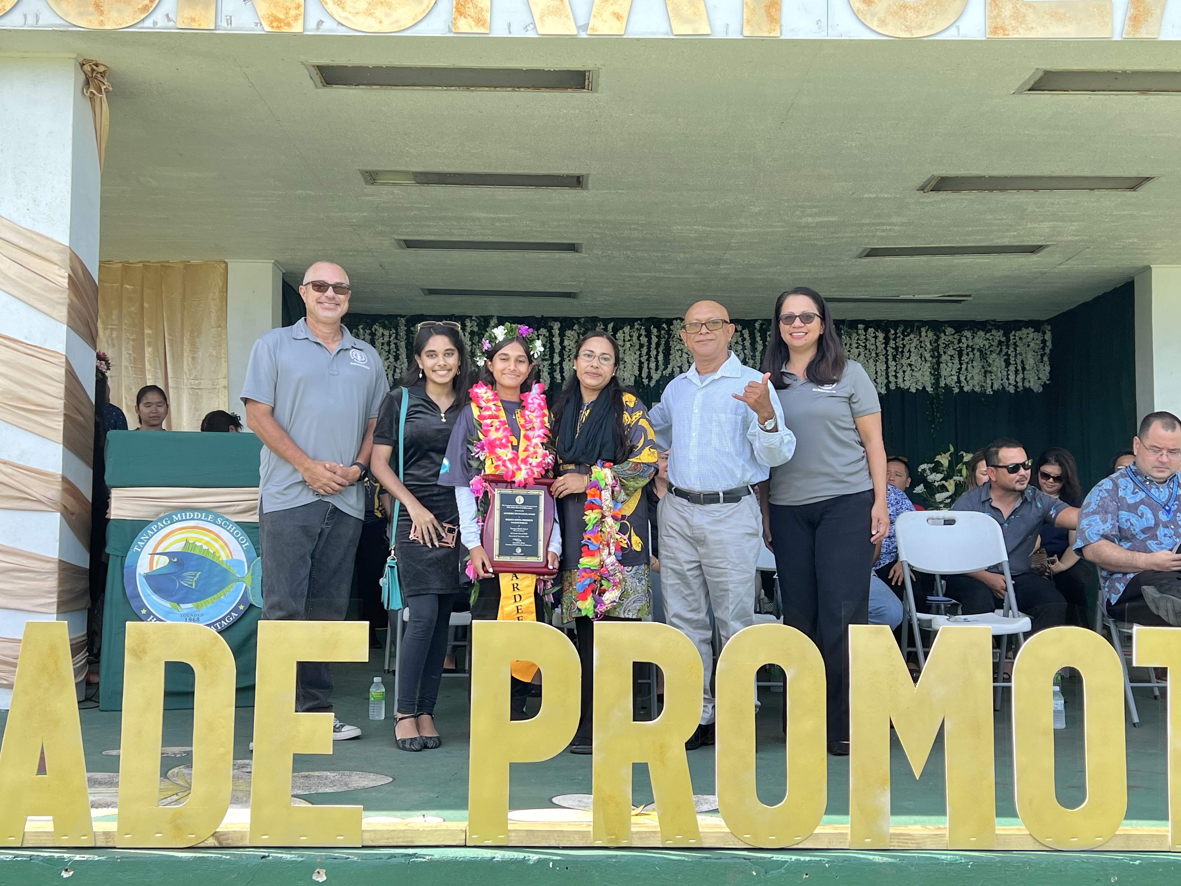 Class Valedictorian and Board of Education Academic Excellence Award recipient Raiana Sofia Ferdous and her parents pose for a photo with Board of Education Secretary/Treasurer Gregory Pat Borja and BOE Member Maisie B. Tenorio.