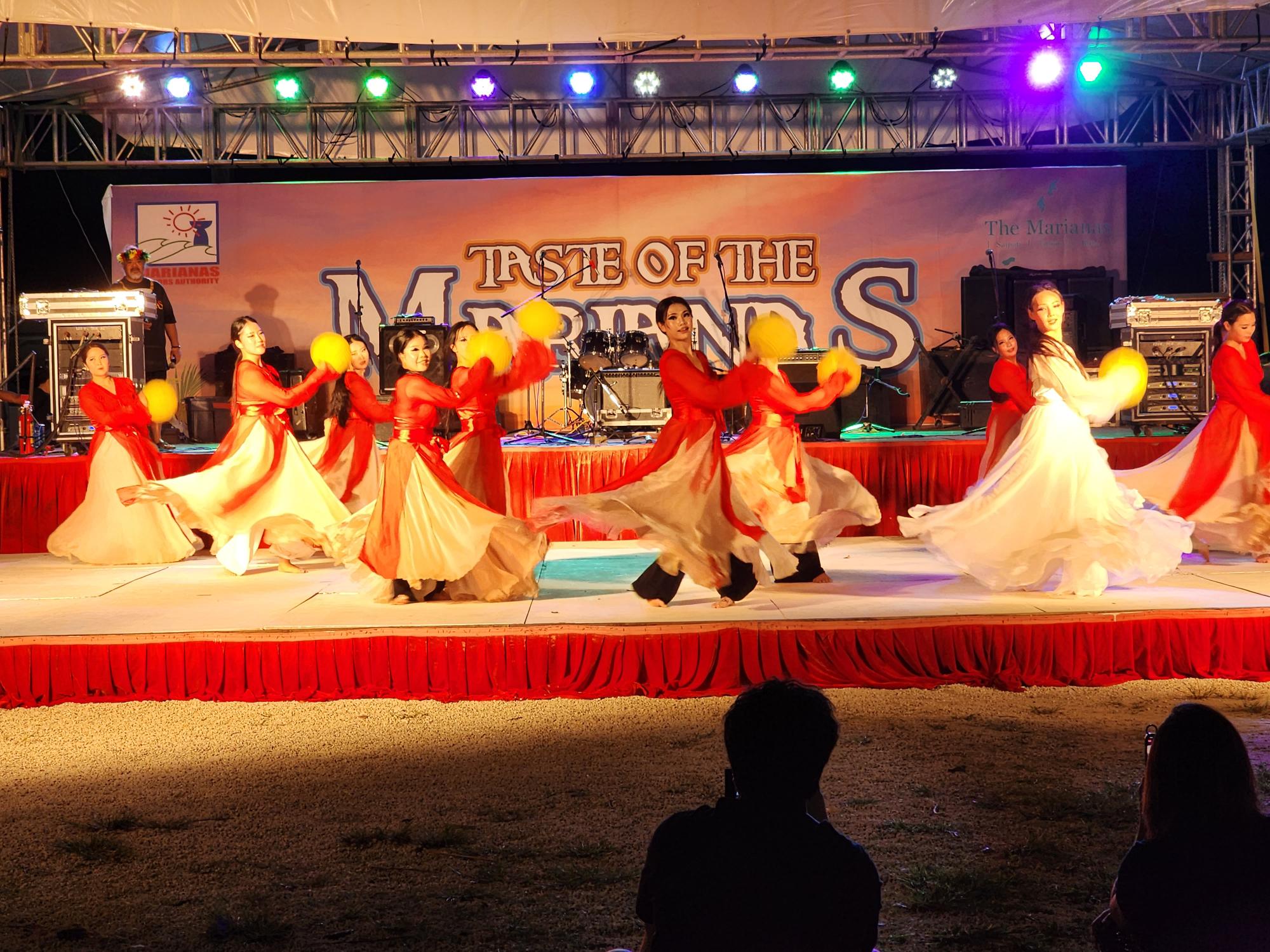 Performers with the Kim So Hee Dance Academy showcase a traditional Korean dance number.