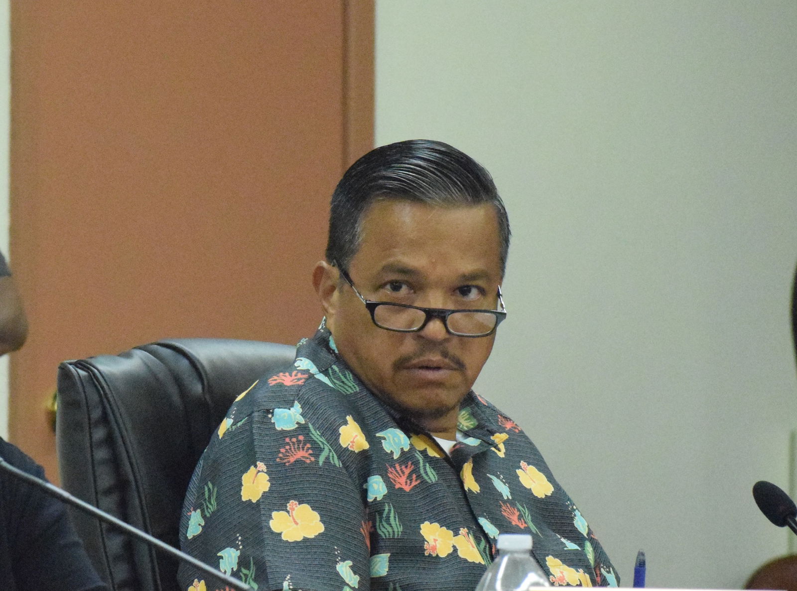 Sen. Jude Hofschneider listens during the public comment portion of a  Senate session.