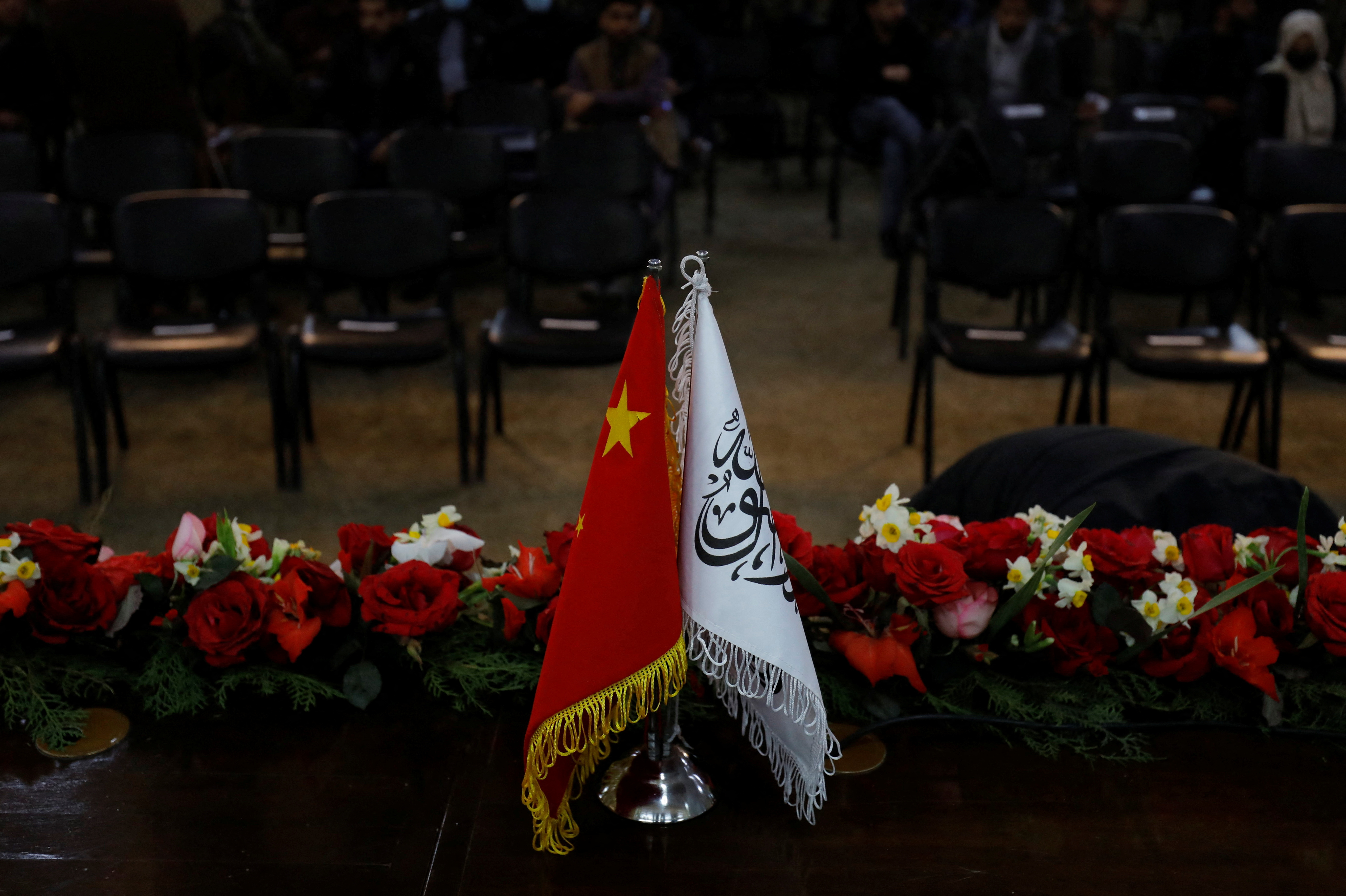The flags of the China and the Islamic Emirate of Afghanistan are displayed during a news conference held by Afghan Deputy Prime Minister Mullah Abdul Ghani Baradar and Wang Yu, China's ambassador in Afghanistan, in Kabul, Afghanistan, January 5, 2023. REUTERS/Ali Khara/File photo