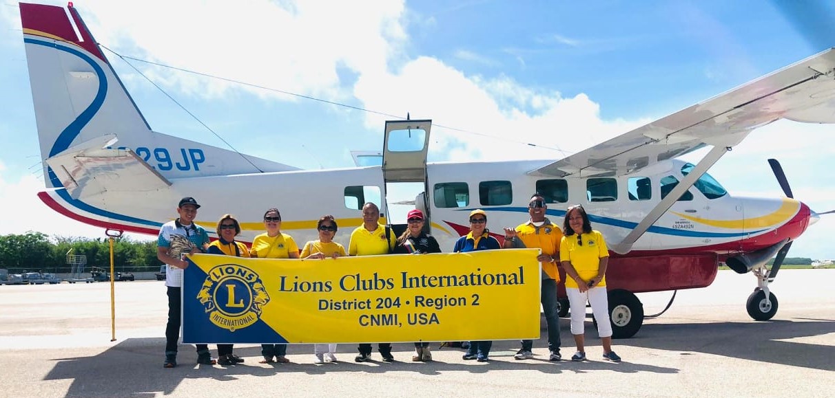 Lions Club International District 204 Region 2 officers and members are ready to distribute Typhoon Mawar relief goods on Rota.