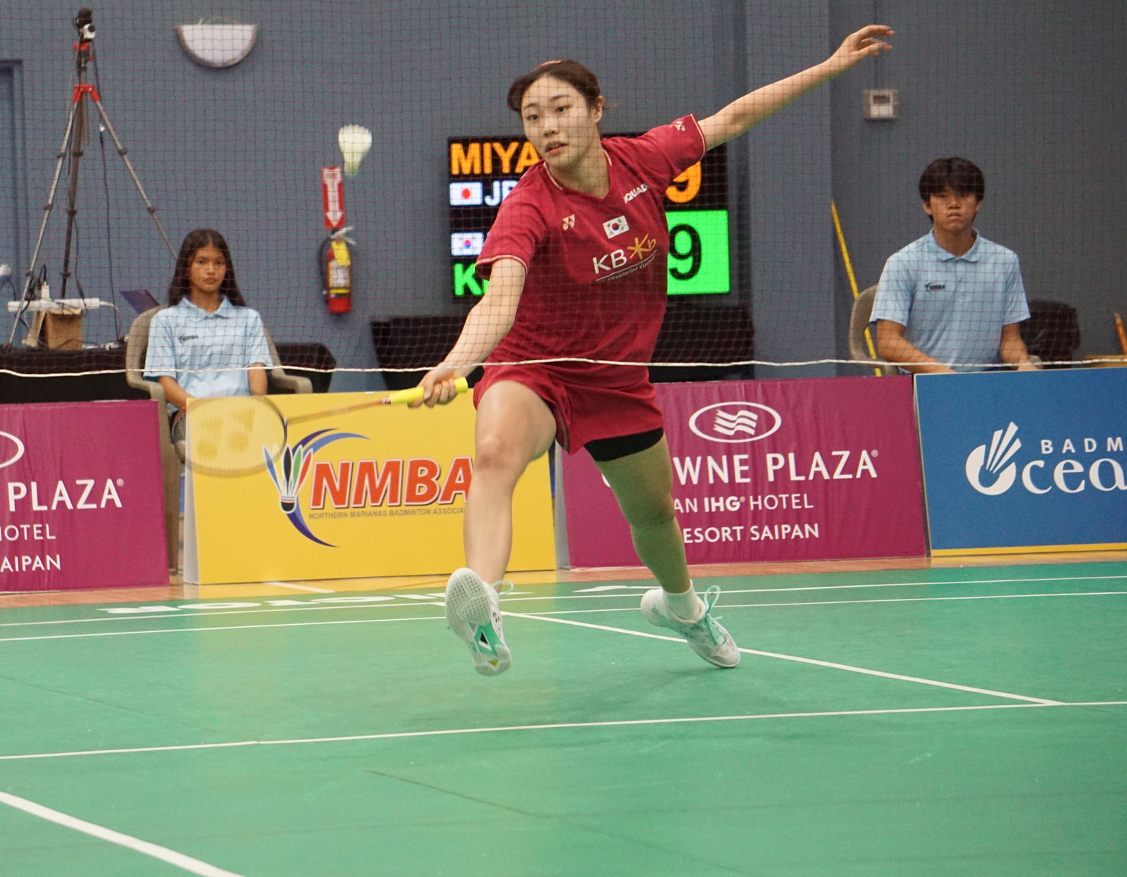 South Korea's Kim Ga Ram steps forward and extends for the lob return against Japan's Tomoka Miyazaki during the women's singles finals of the Northern Marianas Open 2023 at the Ada gym on Sunday.