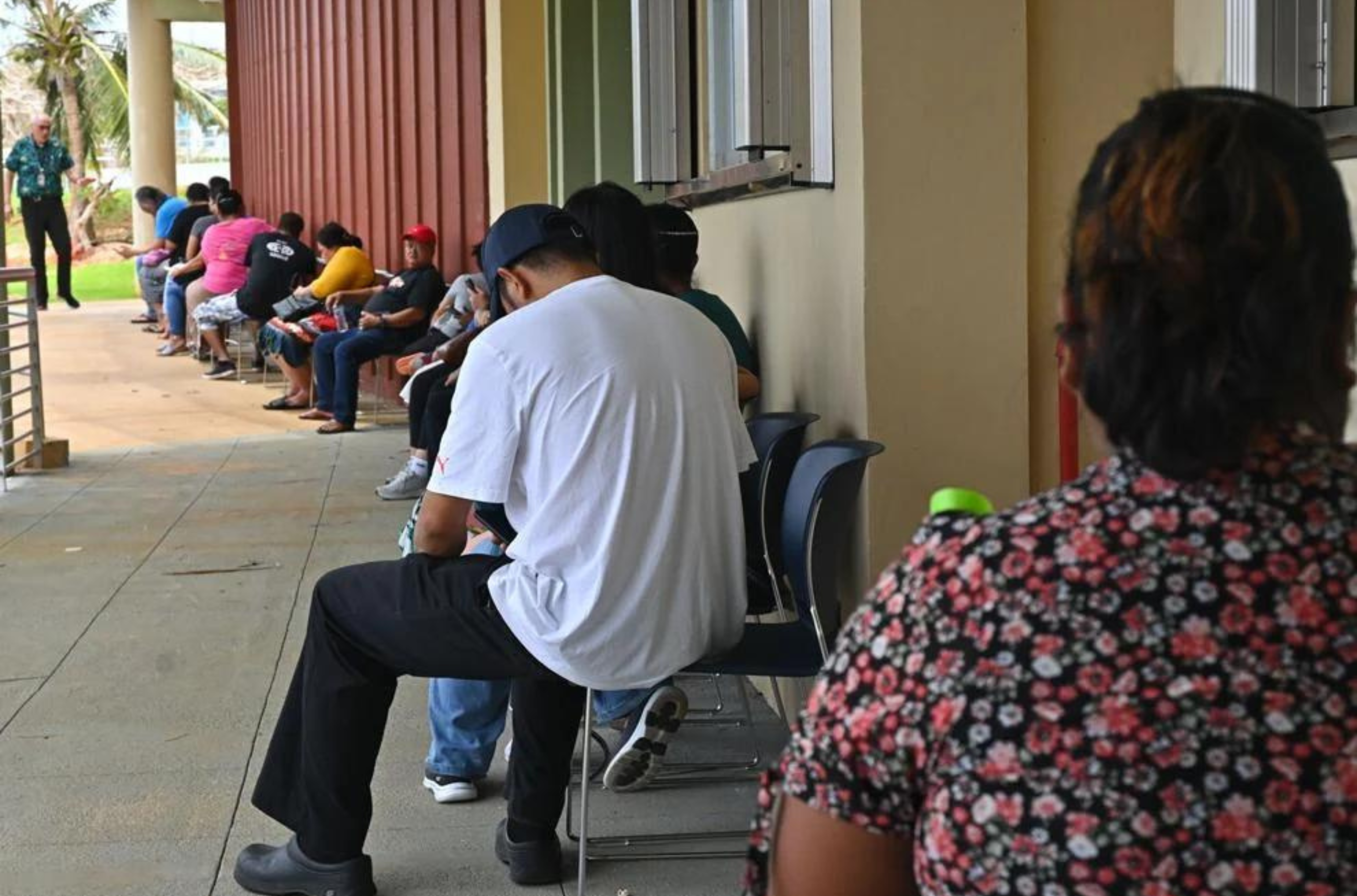 People wait in line at the Federal Emergency Management Agency Disaster Recovery Center on Sunday, June 4, 2023, at Guam Community College in Mangilao.